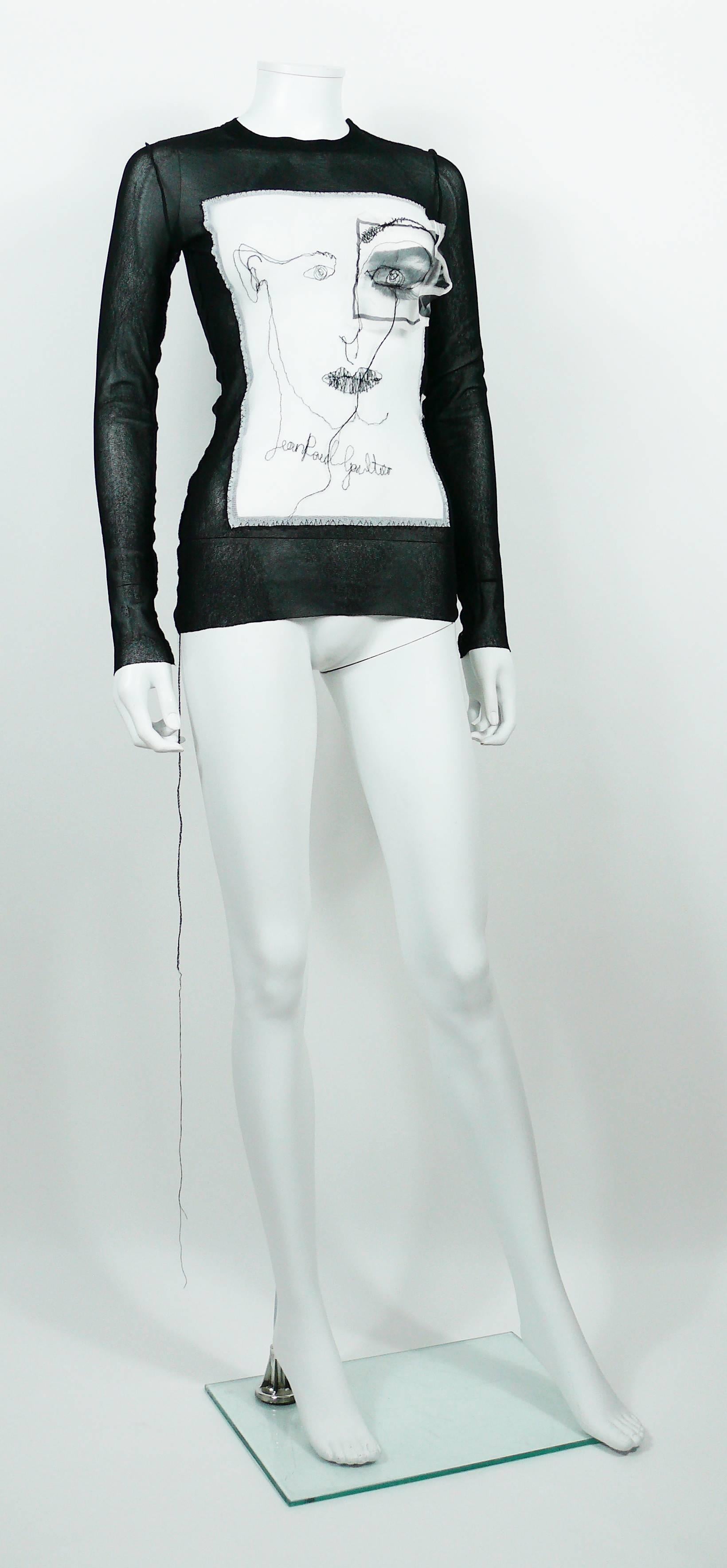JEAN PAUL GAULTIER Maille Femme black sheer mesh top with embroidered portrait and eye applique.

This stretchy mesh nylon top is embroidered with black JEAN PAUL GAULTIER cursive signature.

Label reads JEAN PAUL GAULTIER Maille Femme Made in