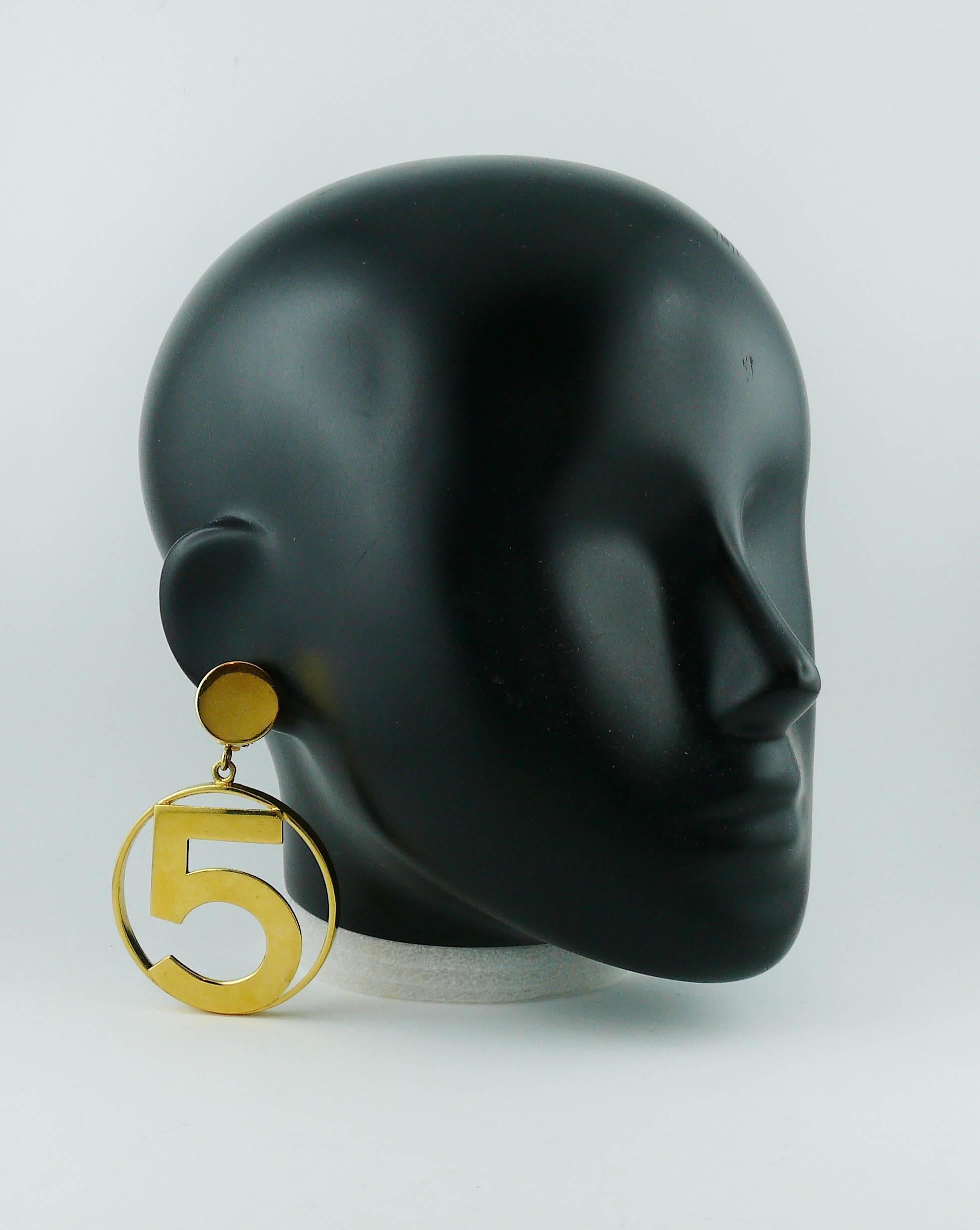 CHANEL rare and collectable iconic No 5 massive gold toned hoop earrings (clip-on).

Embossed CHANEL.

Indicative measurements : length approx. 8.2 cm (3.23 inches) / max. diameter approx. 5.5 cm (2.17 inches).

JEWELRY CONDITION CHART
- New or