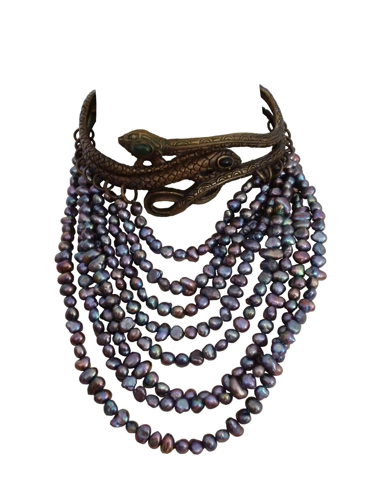 VALENTINO GARAVANI rare runway snake choker necklace.

The top has a rigid section of two intertwined bronze snakes with green and black stones. Antique patina.
Height rows of baroque iridescent freshwater pearl pearls. 
The reverse side has two