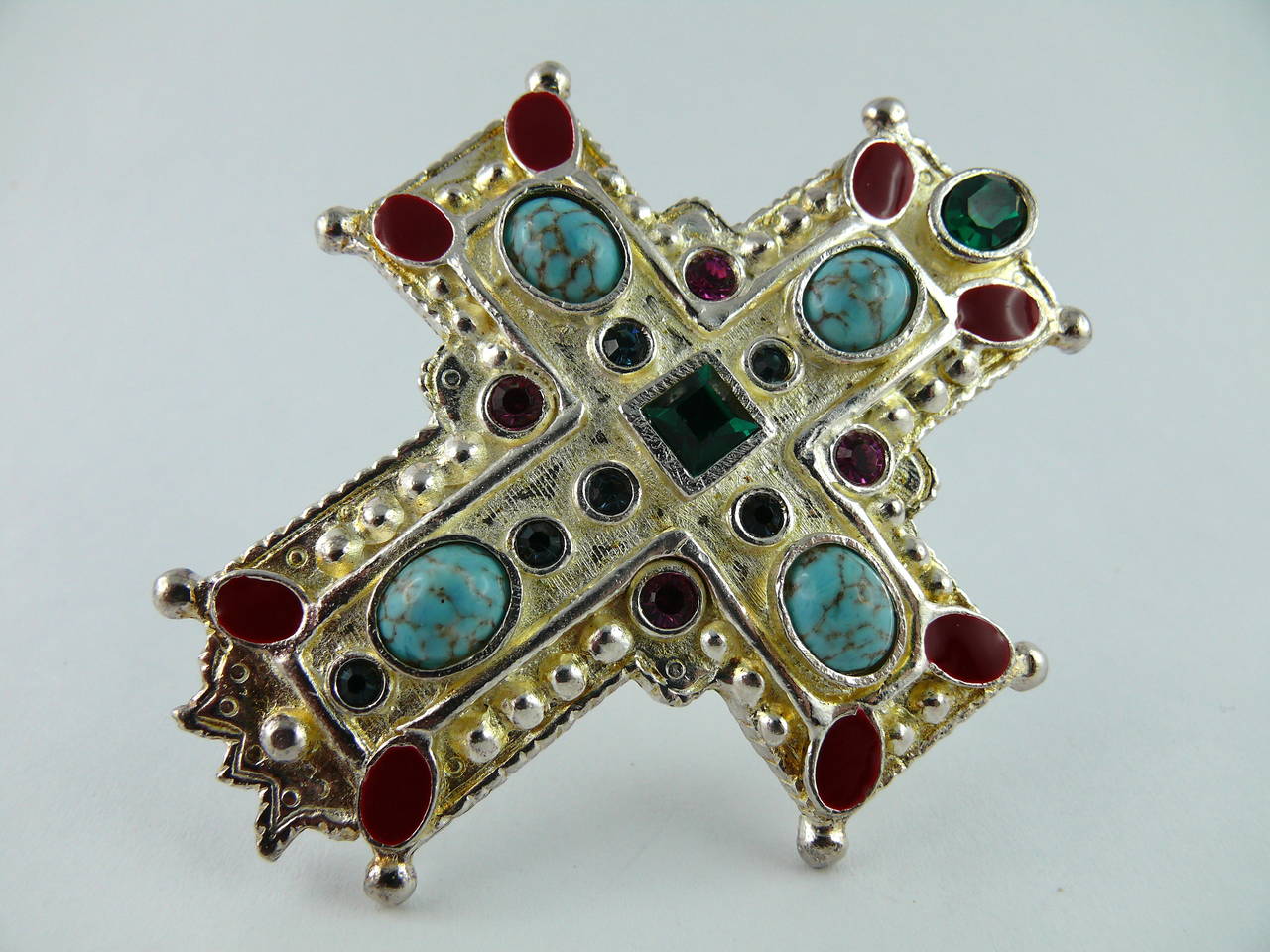 CHRISTIAN LACROIX vintage rare massive jewelled Medieval inspired cross brooch pendant.

Detailed silver tone metal embellished with multicolored crystals, faux turquoise stones and red enamel.

Can be worn as a brooch or a pendant.

Marked