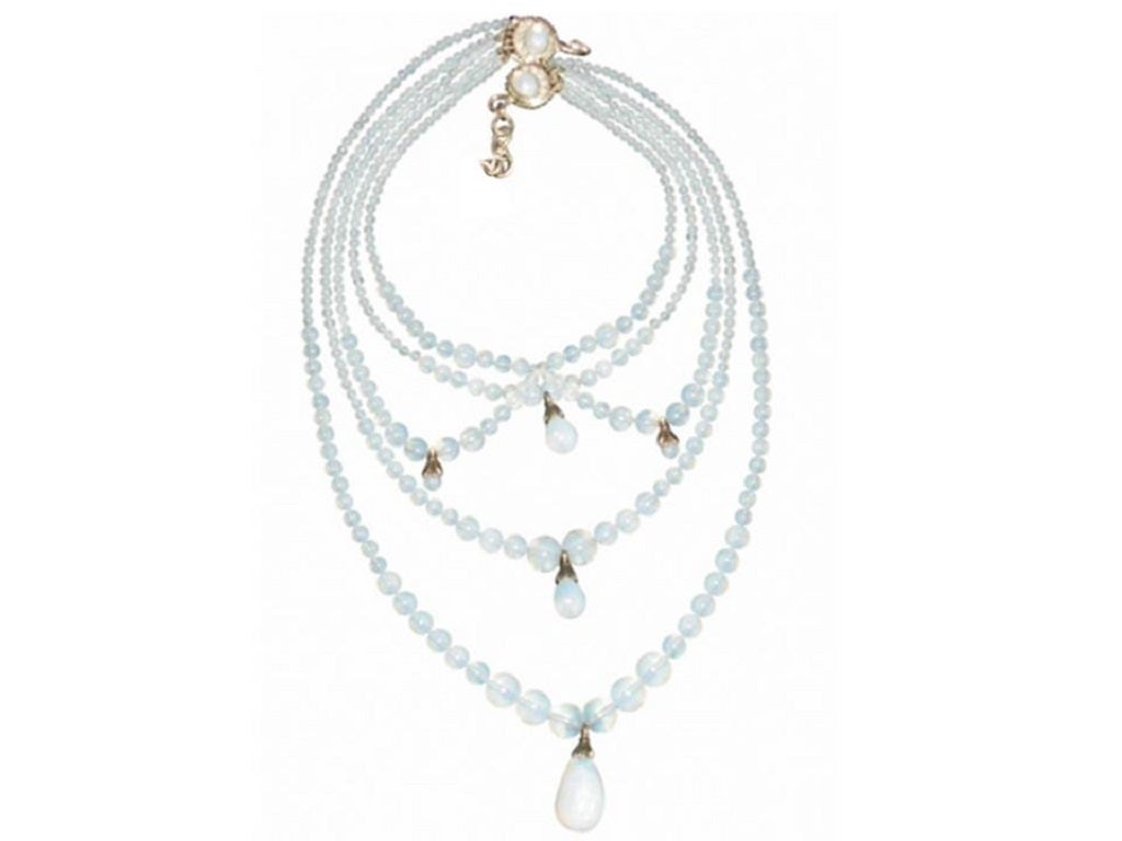 CHRISTIAN DIOR by JOHN GALLIANO rare Victorian inspired multi strand drapery necklace, featuring opalescent glass beads simulating moon stones in a silver tone setting.

Created in the ateliers of Maison Goossens Paris.

Marked CHRISTIAN DIOR
