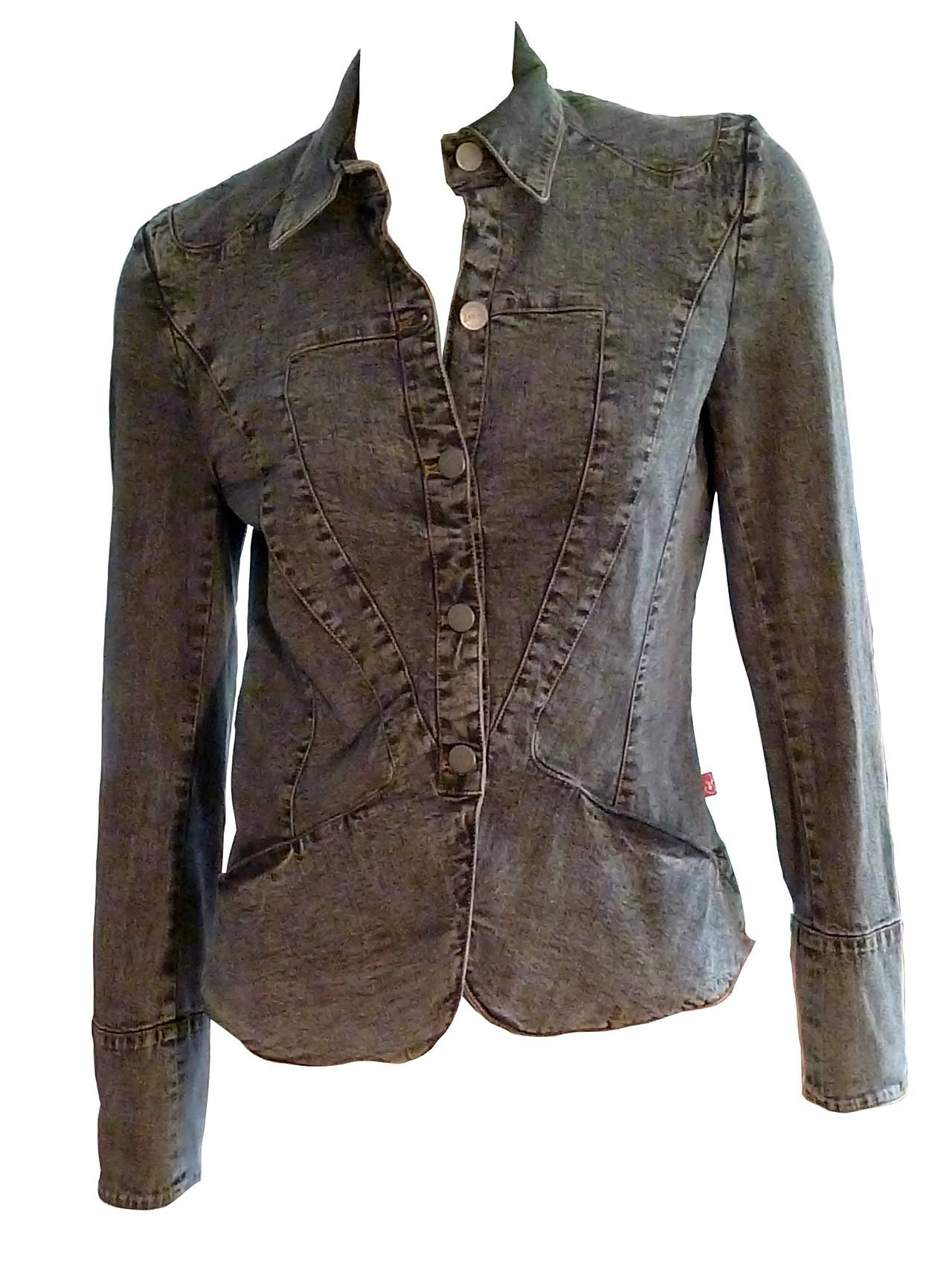 CHRISTIAN LACROIX denim jacket featuring an amazing embroidered heart.

Black distressed denim, slightly stretch, featuring in the back a heart embellished with multicolored embroideries and rhinestones.

Label reads CHRISTIAN LACROIX