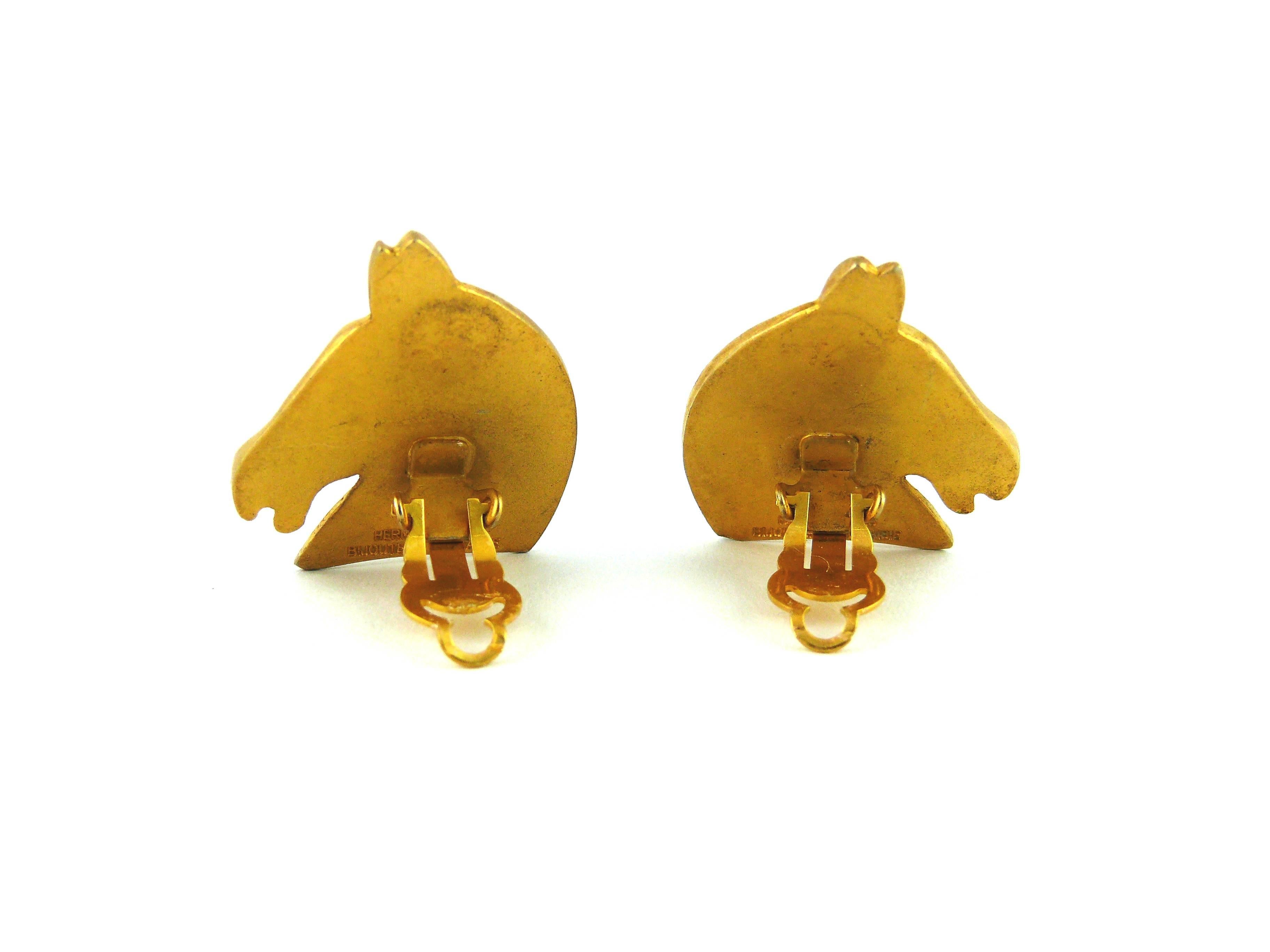 HERMES Paris vintage gold tone iconic clip on earrings featuring a horse head.

Embossed Hermes Paris Bijouterie Fantaisie.

Note
As a buyer, you are fully responsible for customs duties, other local taxes and any administrative procedures