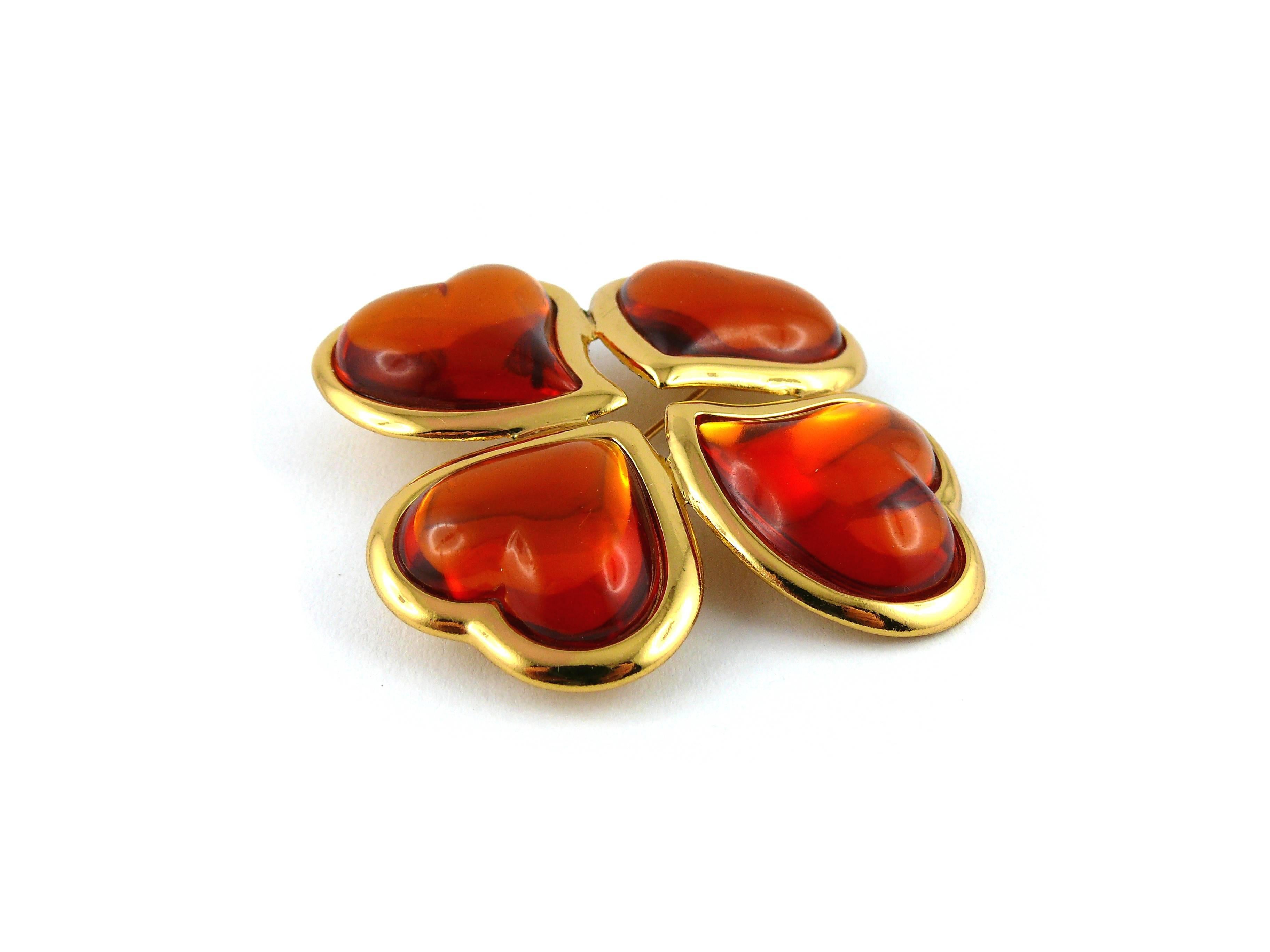 YVES SAINT LAURENT vintage massive clover brooch pendant featuring four large amber resin hearts.

Can be worn as a brooch or a pendant.

Marked YSL Made in France.

JEWELRY CONDITION CHART
- New or never worn : item is in pristine condition