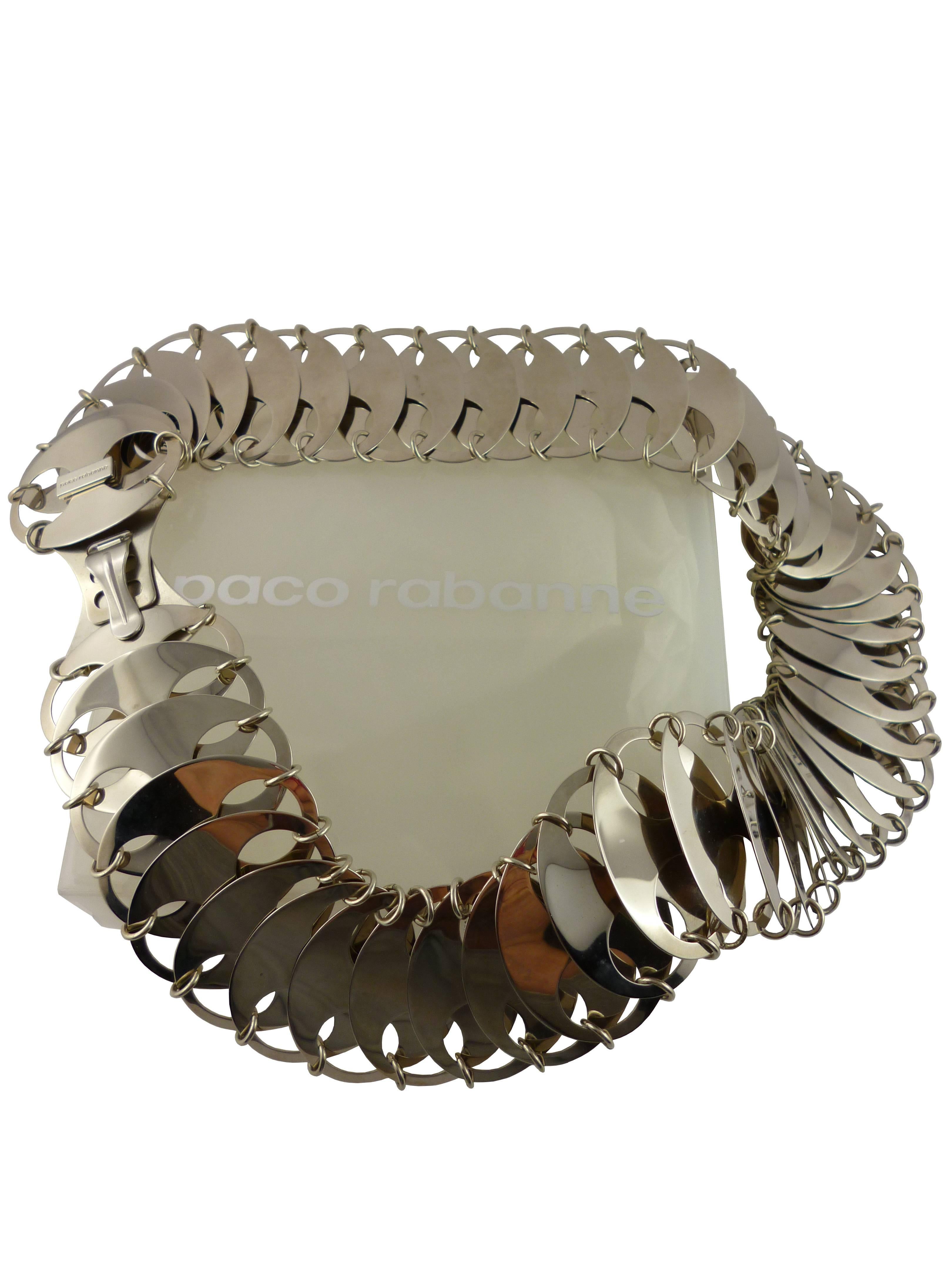 PACO RABANNE stunning iconic metal chain mail disk belt.

Hook closure.

One size fits all.
Length of this belt can be adjusted by removing extra discs.

Marked Paco Rabanne.

Comes with its original box.

BELT CONDITION CHART
- New or