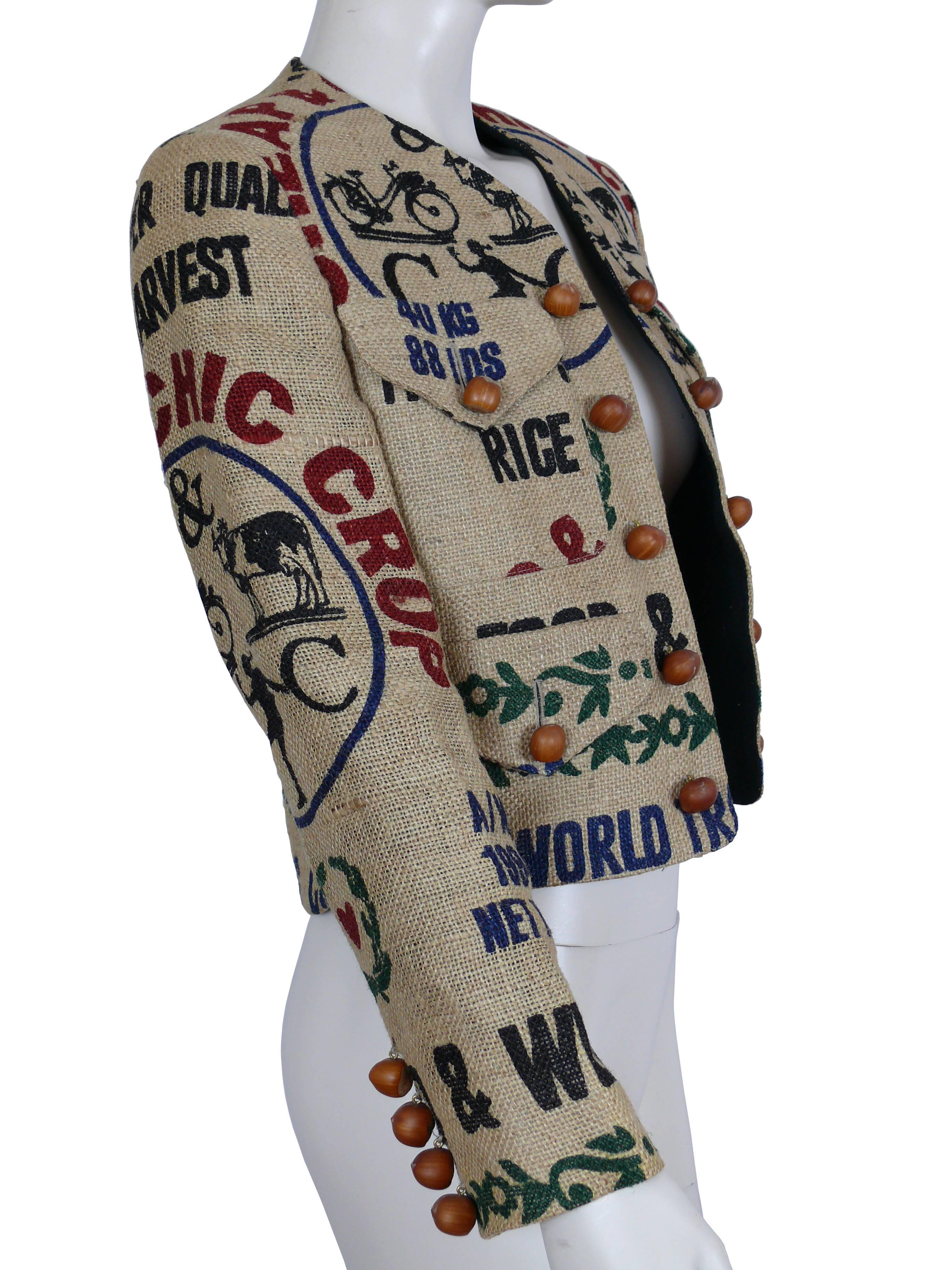 MOSCHINO vintage iconic short length jacket from Fall-Winter 1994 Collection made of a printed pure jute material.

Printed in farm stand inspired graphic patterns and the Moschino Cheap and Chic branding.

Open front.
Four front pockets (two