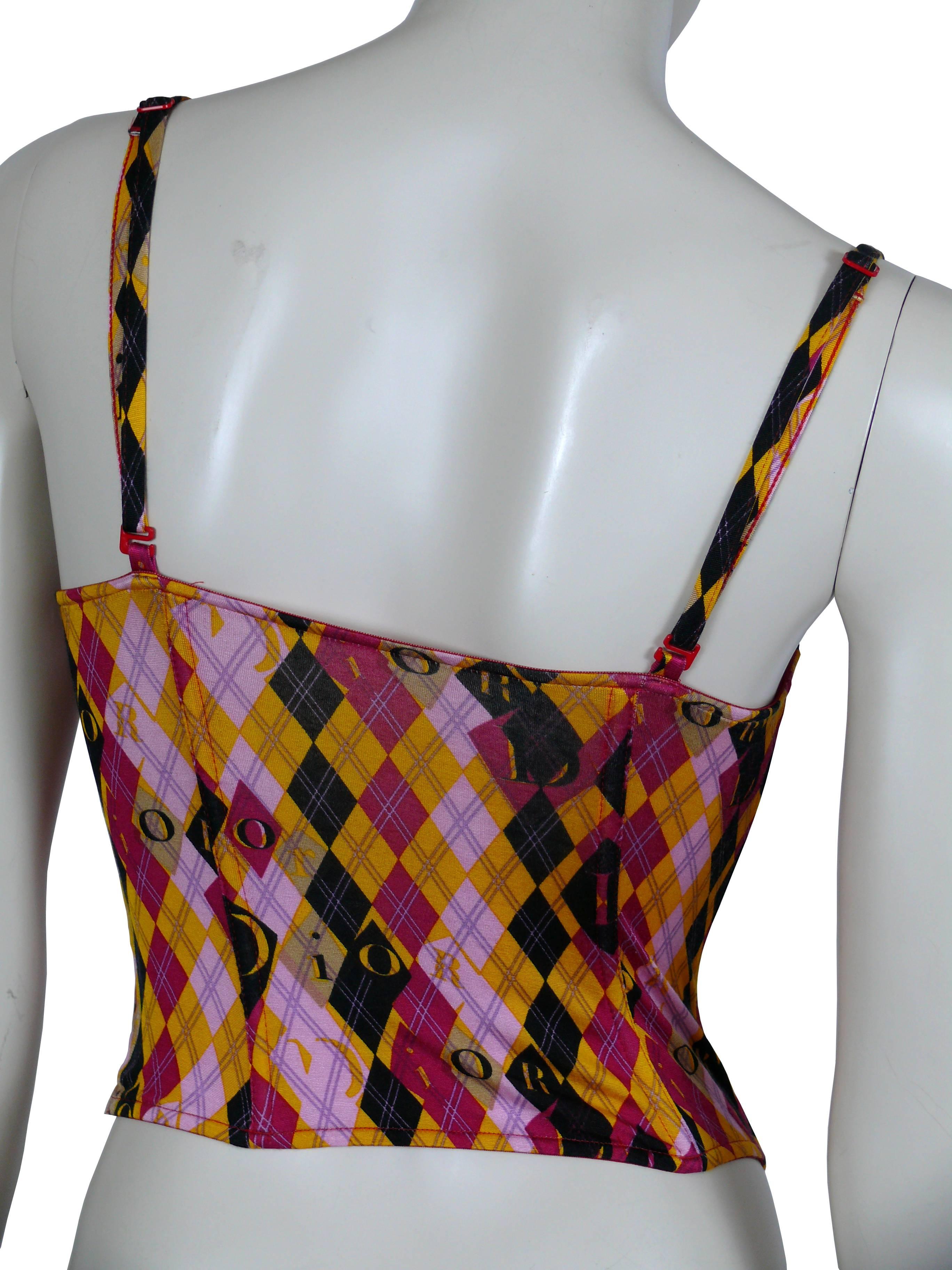 CHRISTIAN DIOR multicoloured Harlequin print bustier top.

New with tag.

Bow detail neckline.
Spaghetti straps.
Side fastening.

Label reads CHRISTIAN DIOR Made in Italy.

Marked Size: FR 85 / EUR 70 / UK 34 / US 32.
Bra FR sizing : 85