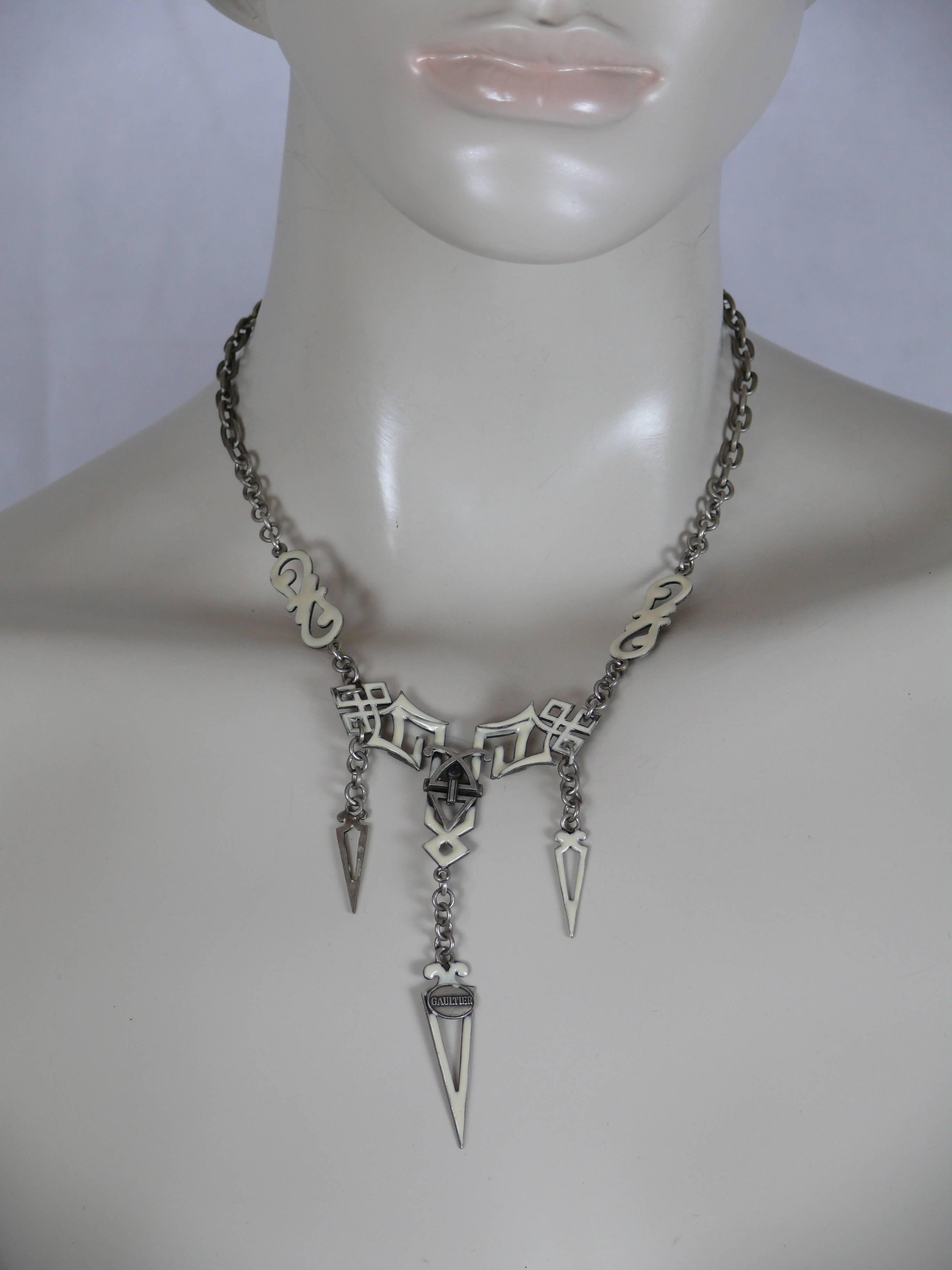 JEAN PAUL GAULTIER vintage celtic pattern design silver tone and off-white enamel necklace.

Marked GAULTIER.

Indicative measurements : total length worn 25.5 cm (10.04 inches).

Comes with original dust bag.

JEWELRY CONDITION CHART
- New