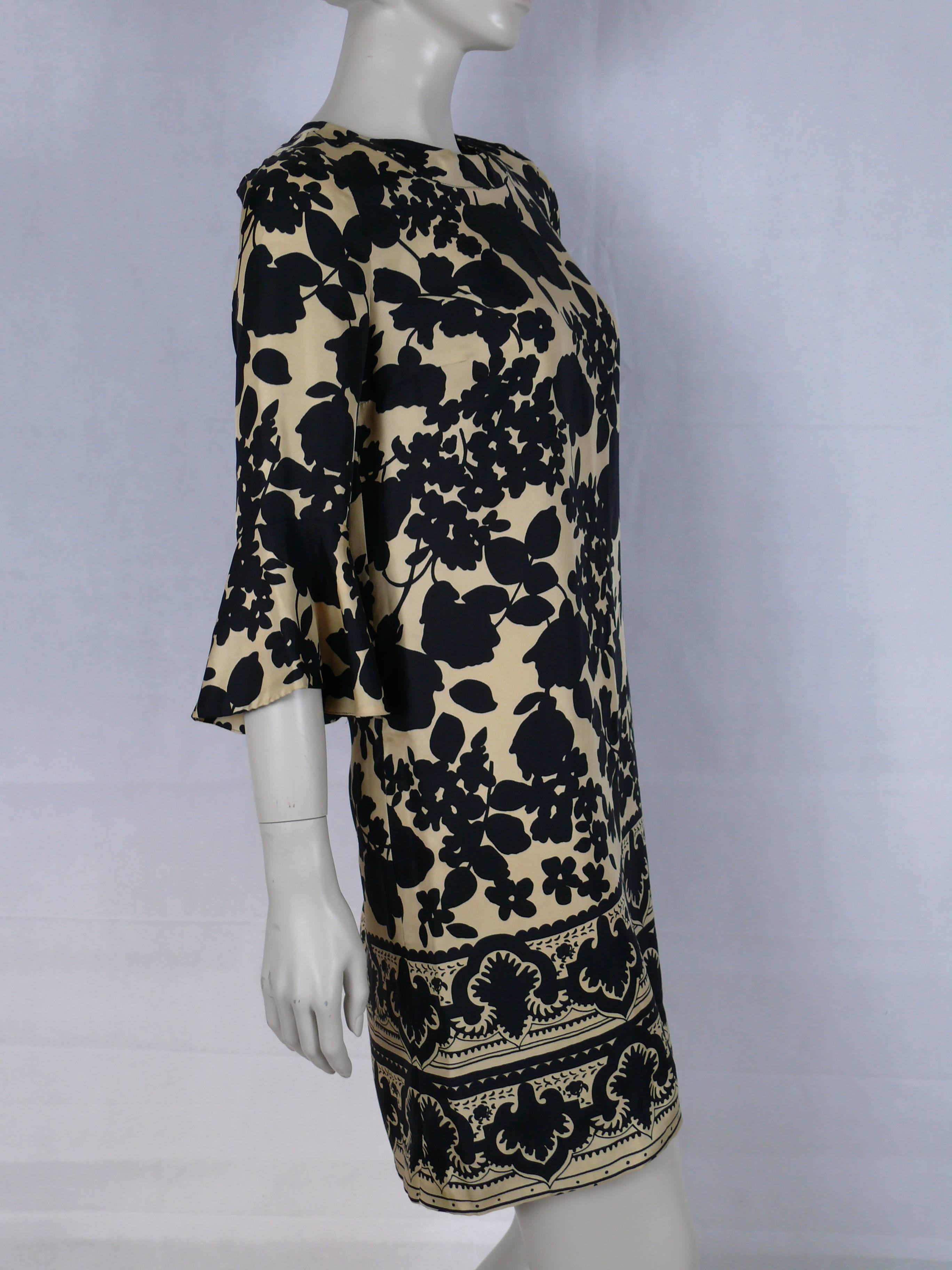 CHLOE silk print dress with black floral design on an ivory background.

Label reads CHLOE Made in France.

Size tag reads : 38.
Please check measurements.

Composition tag reads : 100 % Silk.

Indicative measurements taken laid flat