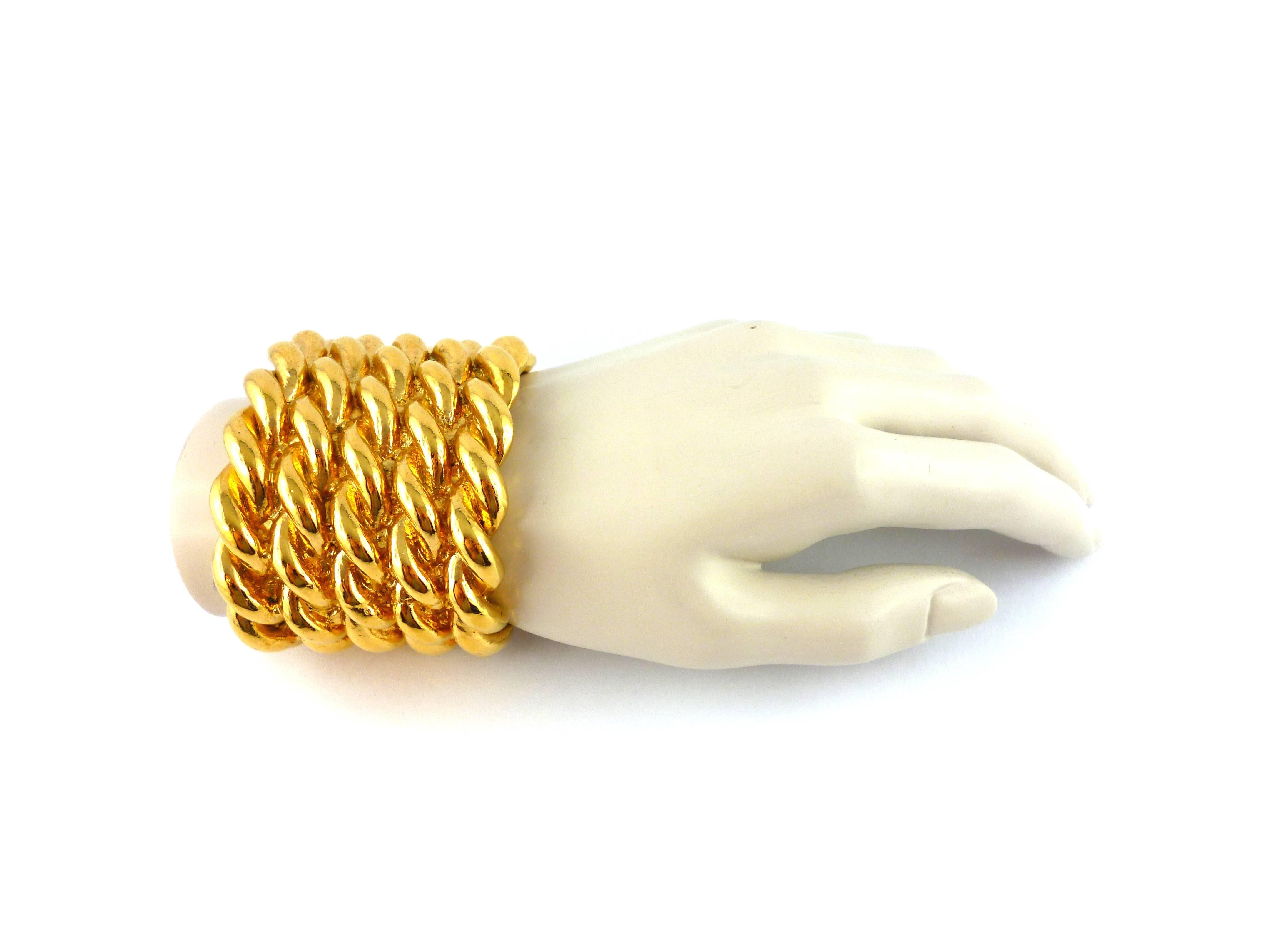 EDOUARD RAMBAUD vintage massive gold toned resin bracelet cuff with a rope-like design.

Embossed EDOUARD RAMBAUD Paris.

Indicative measurements : total width approx. 7.2 cm (2.83 inches) / inside maximum width approx. 6 cm (2.36 inches) /