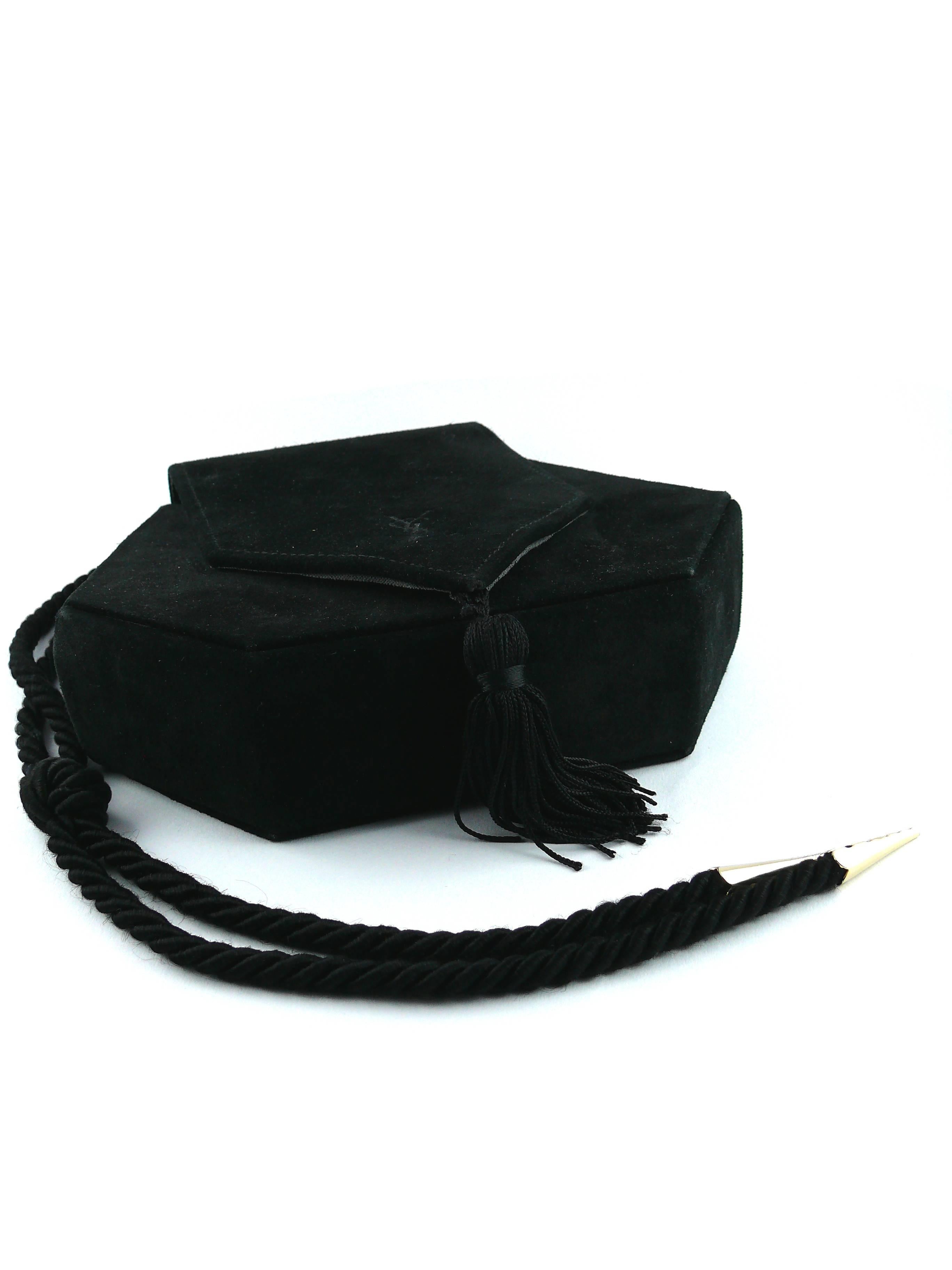 YVES SAINT LAURENT vintage black evening tassel bag purse.

Black suede adorned with a silk tassel.

Braided passementerie straps ending with two gold tone metal cones.  

Adjustable length.

Stamped with the YSL monogram on the flap of the