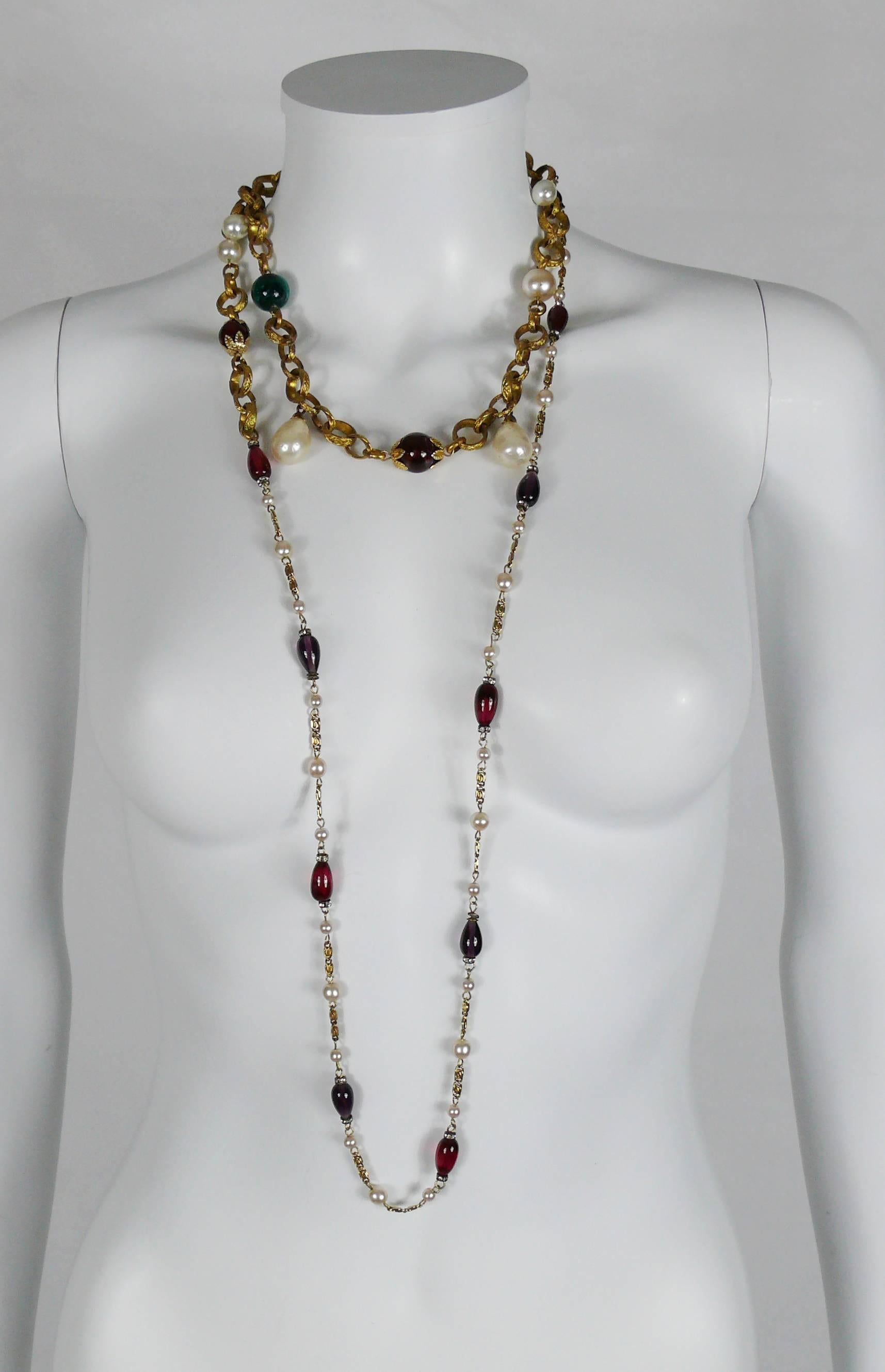 YVES SAINT LAURENT vintage rare 1970's two tiered sautoir necklace featuring a gold tone chain with textured links, faux pearls, red-green-purple GRIPOIX glass cabochons.

Model variant sold at Cornette de Saint Cyr Paris auction on the 13th of