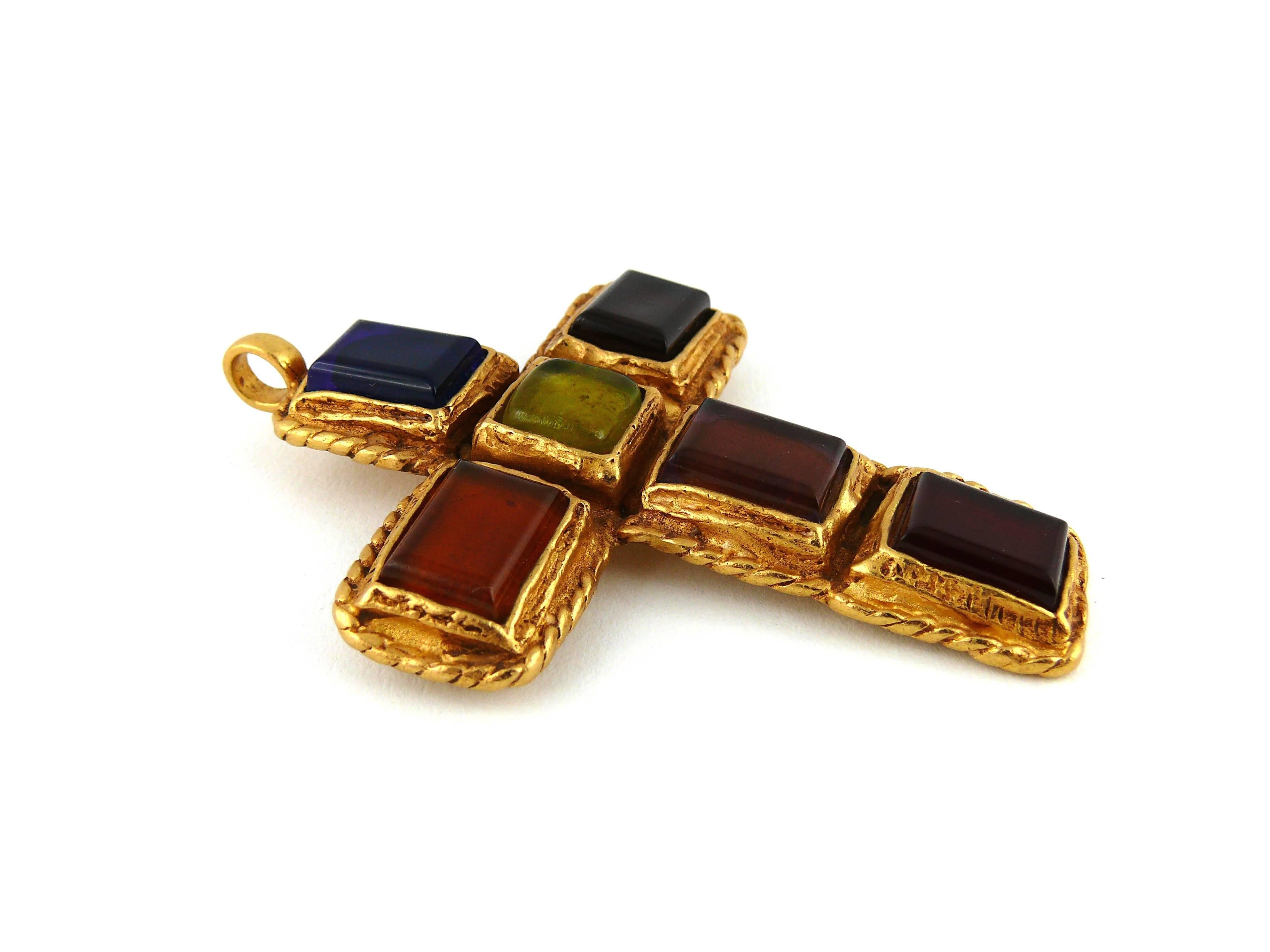 CHRISTIAN LACROIX vintage massive cross brooch pendant.

Multi colored pate de verre cabochons in a textured gold tone setting.

Can be worn as a brooch or a pendant.

Marked CHRISTIAN LACROIX CL Made in France.

Indicative measurements : total