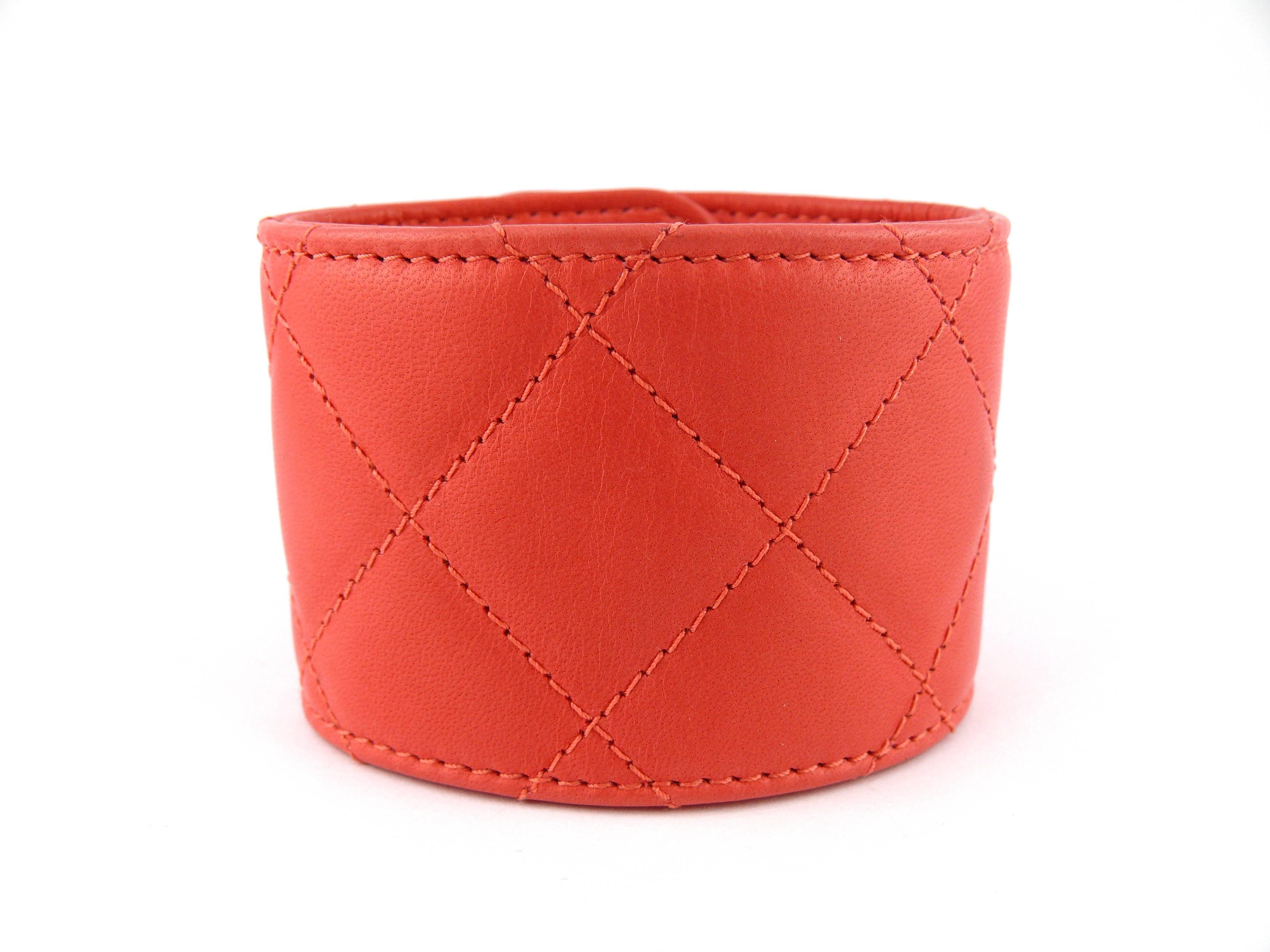 CHANEL lambskin leather cuff bracelet featuring a gun metal CC turn lock.

Stunning coral color, perfect for Spring/Summer !

Embossed on the leather CHANEL B 12 C Made in Italy.
Engraved with the "S" mark for private sale - see photo #3 -