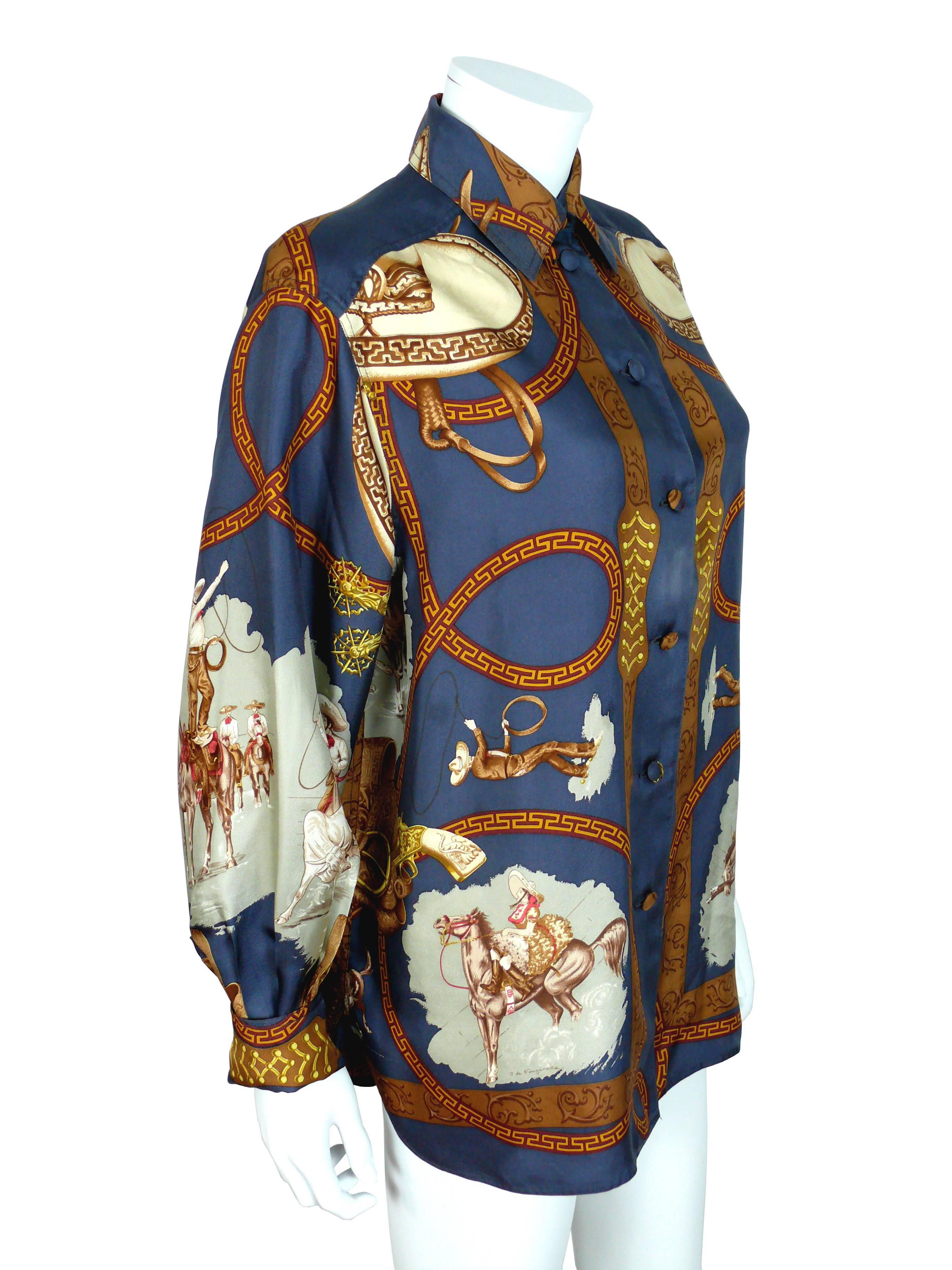 HERMES vintage "Charreada" navy silk twill in shades of brown, red, yellow & grey featuring Mexican cowboys & cowgirl designs in vignettes of roping steers.

Design  J DE FOUGEROLLE.

Long sleeves.
Front buttons.
Matching