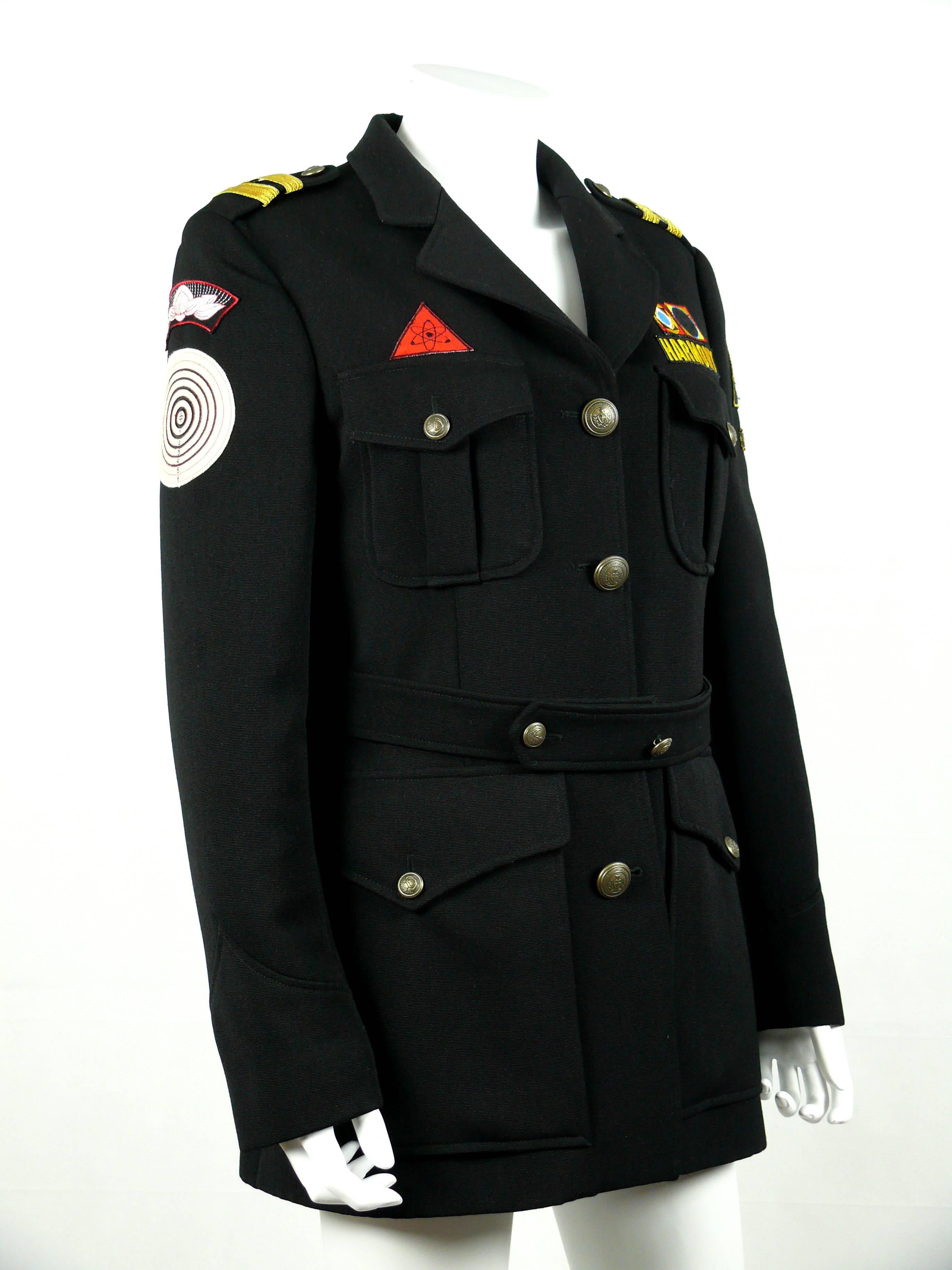 MOSCHINO vintage stunning black military style wool jacket wishing Harmony and Meditation.

Ironic sewn appliques featuring military badges : Yin Yang, No Nukes, No Targets, Chakra...

Front buttoning saying 