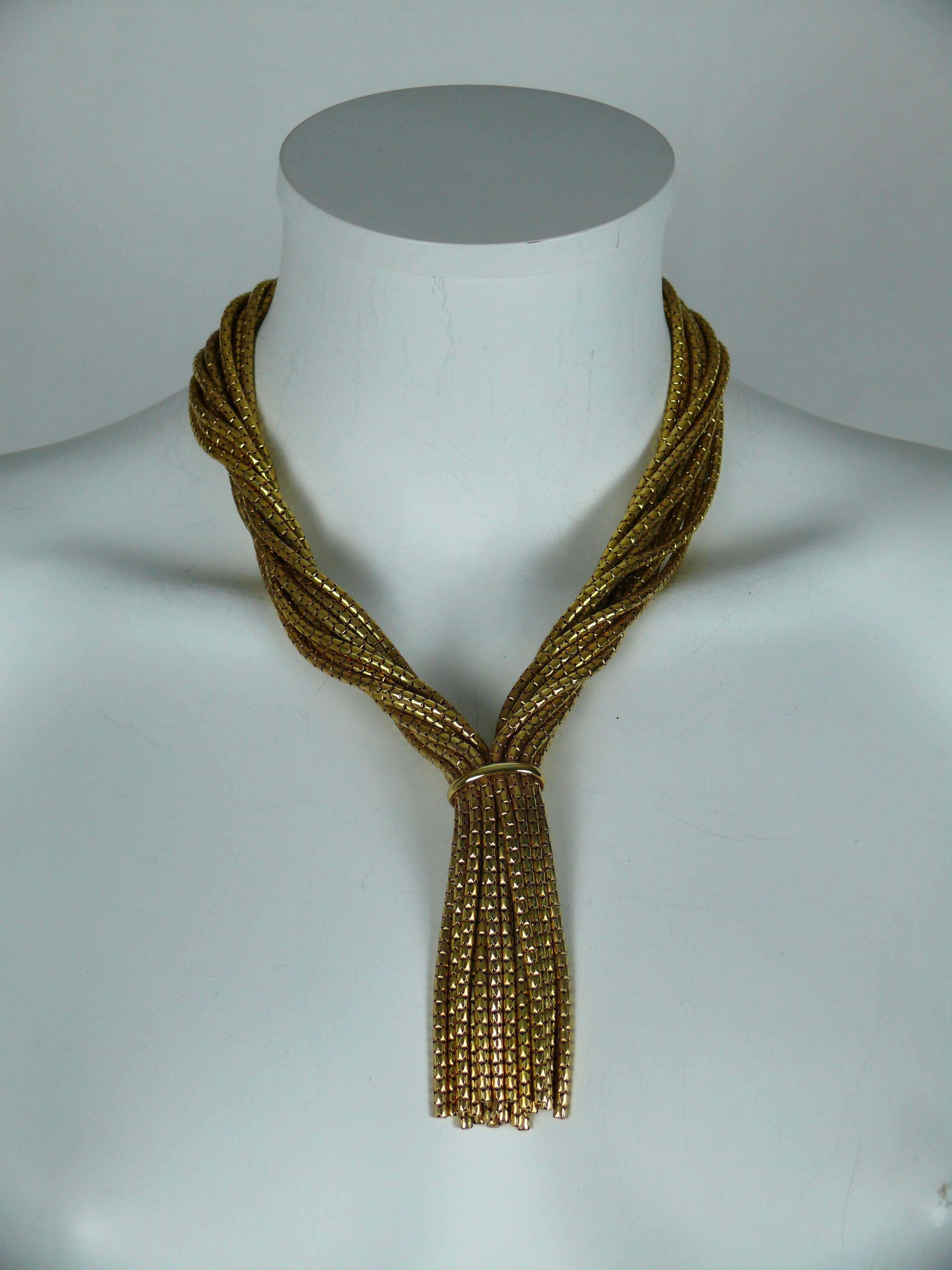 CHRISTIAN DIOR vintage gold toned twisted multi chain tassel necklace.

All chains cluster together and meet at a chunky hidden push clasp.

Embossed CHR. DIOR Germany.
Dated 1967.

Comes with original box (in vintage condition).

JEWELRY CONDITION