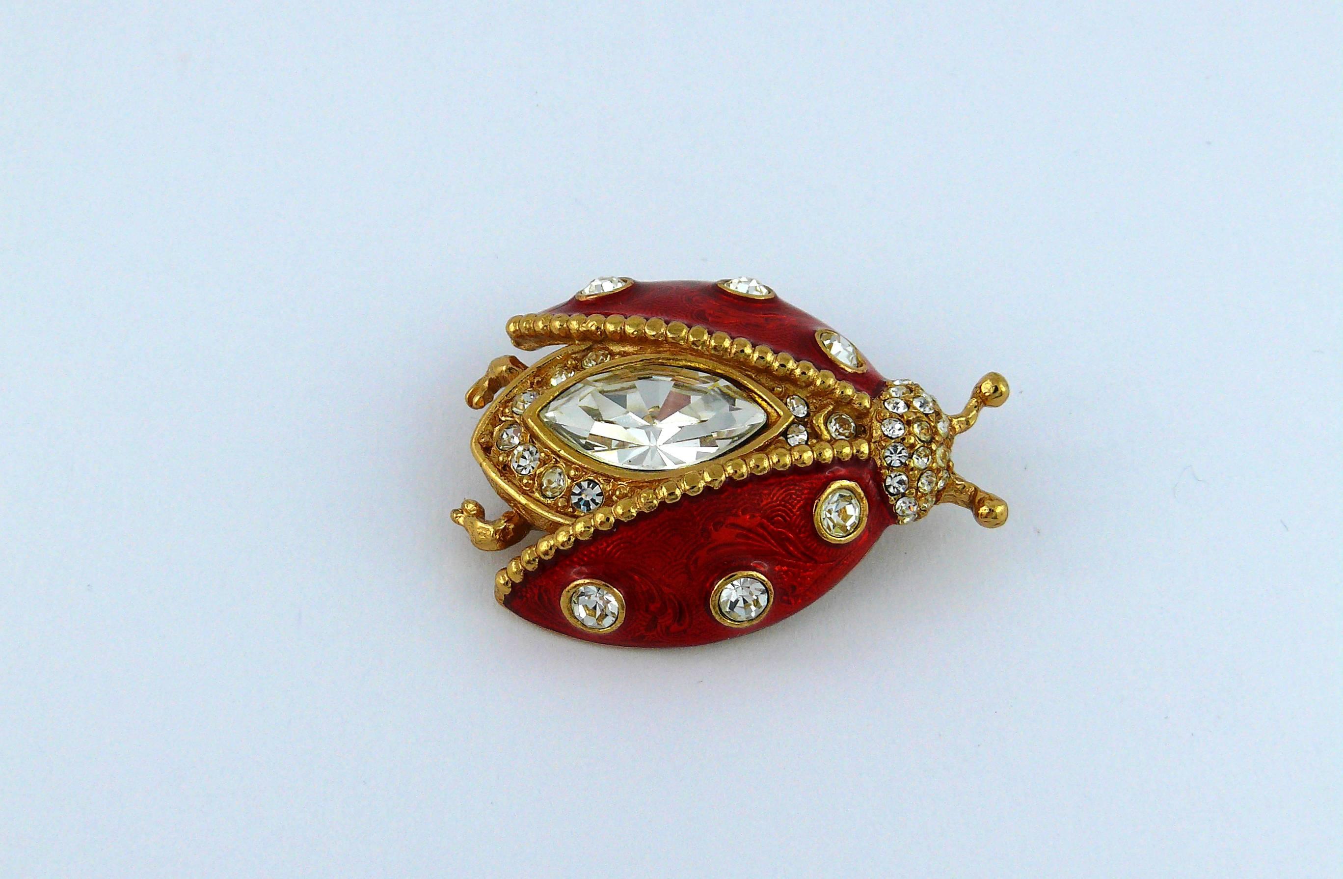 CHRISTIAN DIOR Boutique vintage rare jeweled ladybug brooch.

Enameled gold tone metal, embellished with white rhinestones.

Marked CHRISTIAN DIOR Boutique.

Note
As a buyer, you are fully responsible for customs duties, other local taxes and