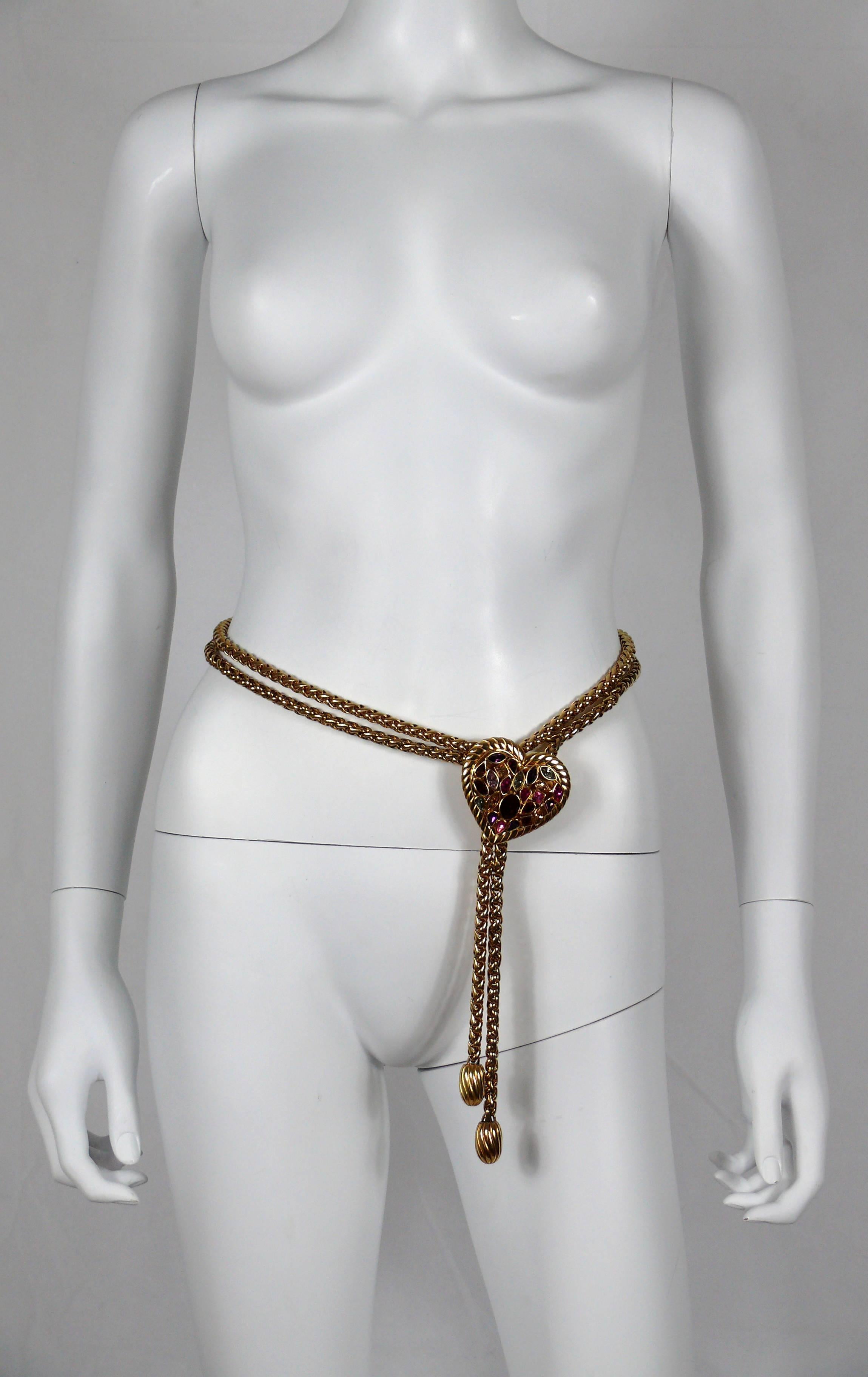 YVES SAINT LAURENT vintage rare gold tone double chain belt adorned with a jewelled heart.

Can be worn as a belt or choker necklace.

Adjustable length (4 notches).

Embossed YSL Made in France.

Indicative measurements : total length approx. 89 cm