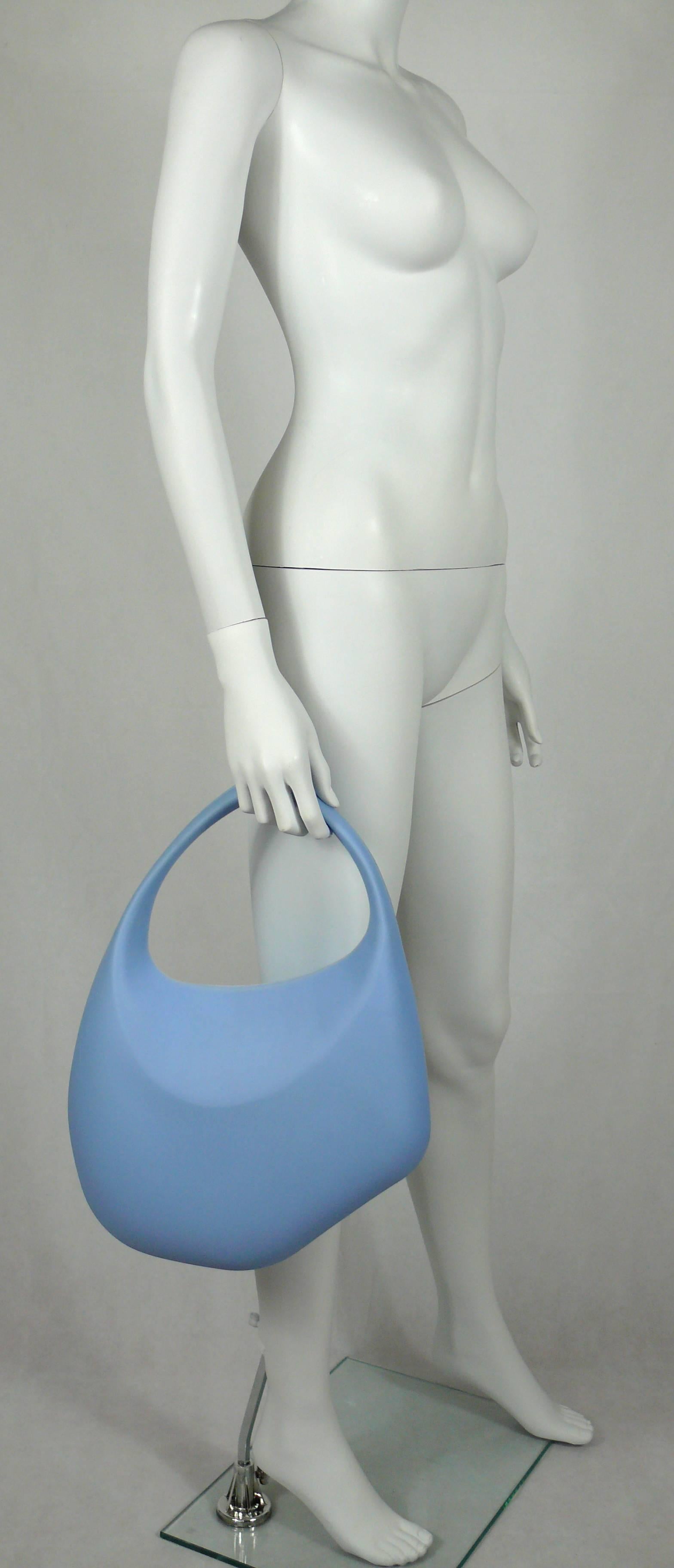 THIERRY MUGLER vintage iconic Bubble rubber handbag in a very rare blue color.

True color is difficult to photograph. Exact color is close to THIERRY MUGLER's signature ice blue.

Organic shape.
Metal ball snap closure, embossed with THIERRY MUGLER