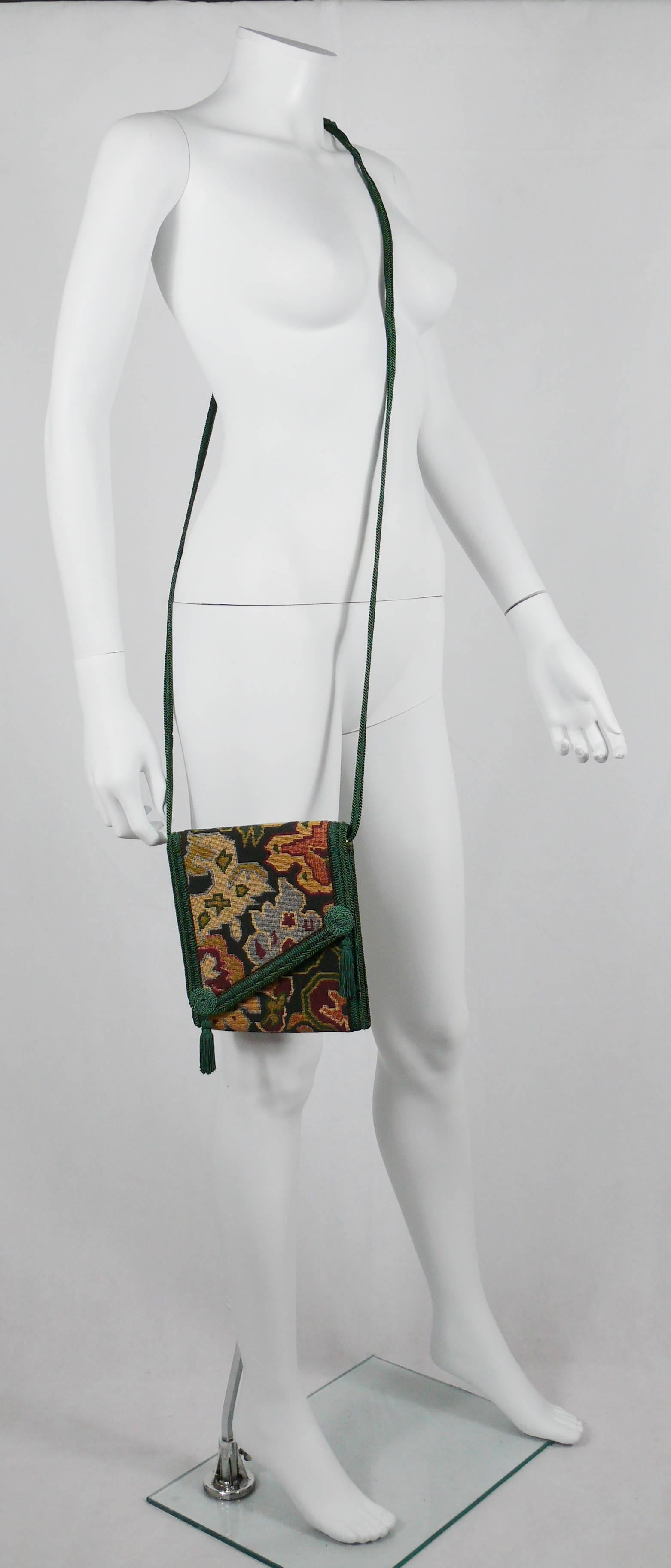 CHRISTIAN DIOR vintage cross body messenger bag featuring a kilim tapestry design, braided green silk strap and tassels.

Black leather lining.

Marked CHRISTIAN DIOR Made in France.

Indicative measurements : total length (incl. strap) approx. 95