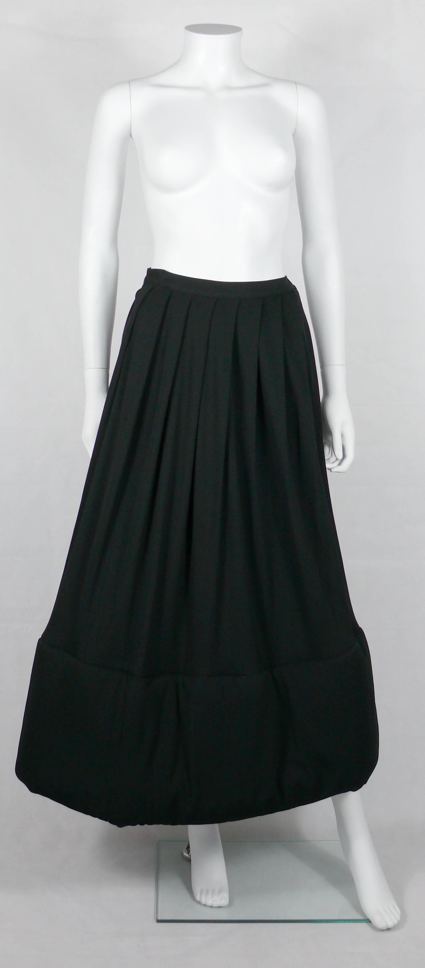 JEAN PAUL GAULTIER Classique vintage 1990s rare black pleated long skirt featuring a lower wide  padding section.

Side zip and one button.

Label reads JEAN PAUL GAULTIER Classique Made in Italy.

Marked Size : I 42 / D 38 / F 38 / GB 10 / USA