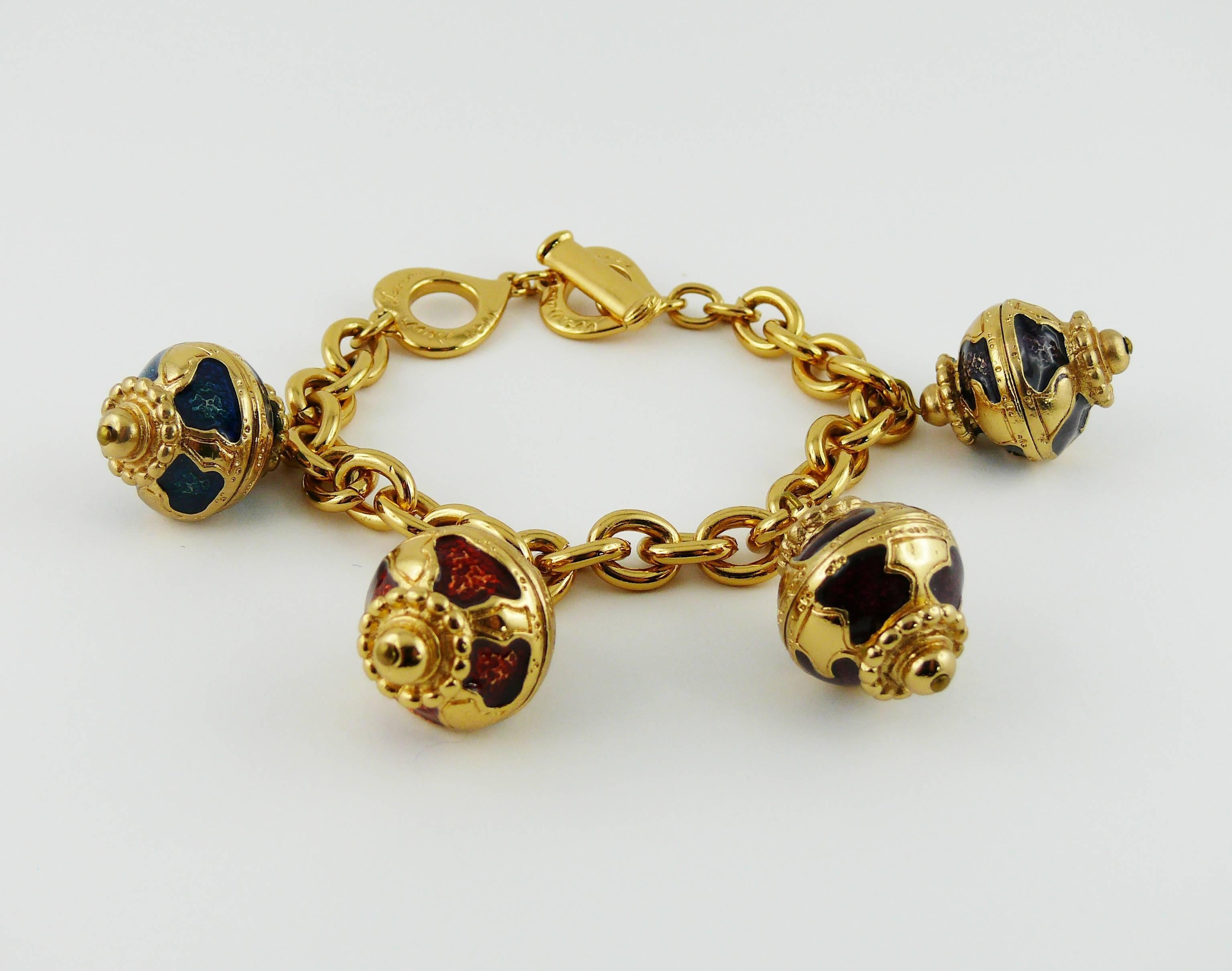 YVES SAINT LAURENT vintage gold tone charm bracelet featuring four gorgeous emaled olive shaped Russian style charms.

Toggle closure.

Embossed YVES SAINT LAURENT Made in France.

Indicative measurements : total length approx. 21 cm (8.27 inches) /