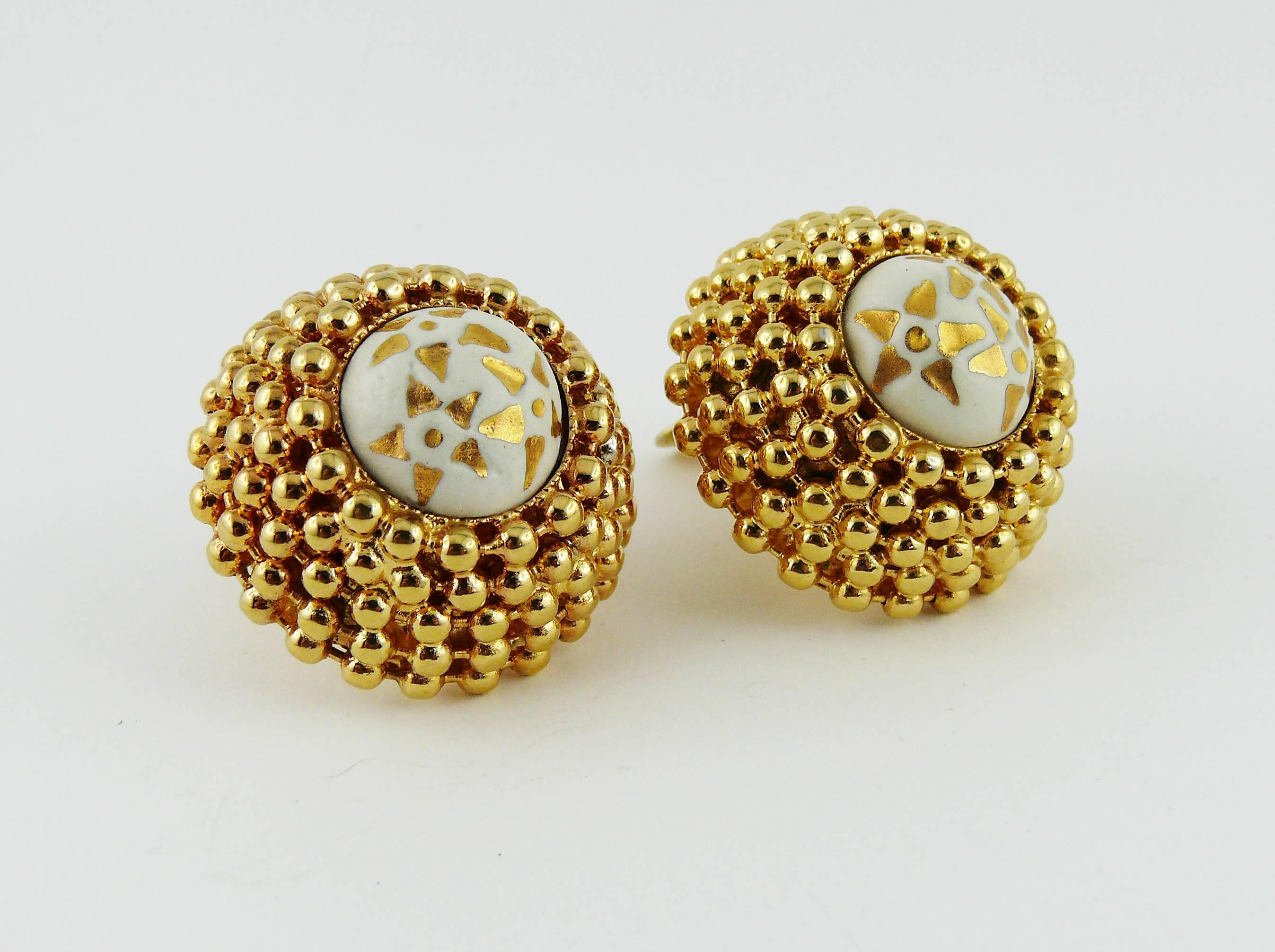 CELINE Paris vintage 1989 large gold tone round domed shape clip-on earrings featuring iconic brand star logo hand painted in gold color on a white ceramic base.

Marked CELINE 89 Made in Italy.

JEWELRY CONDITION CHART
- New or never worn : item is