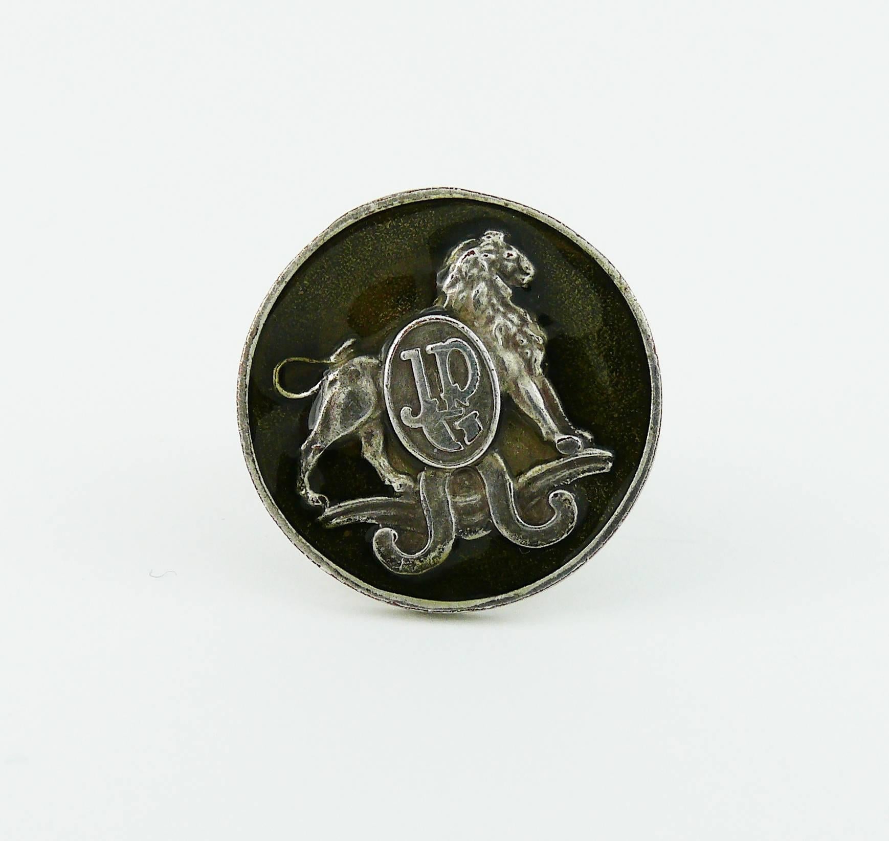 JEAN PAUL GAULTIER vintage 1990s enameled ring featuring a lion in a silver tone with antique patina setting.

JPG initials at the front.

Indictive measurements : inside circumference approx. 5.65 cm (2.22 inches) / diameter of the top coin approx.