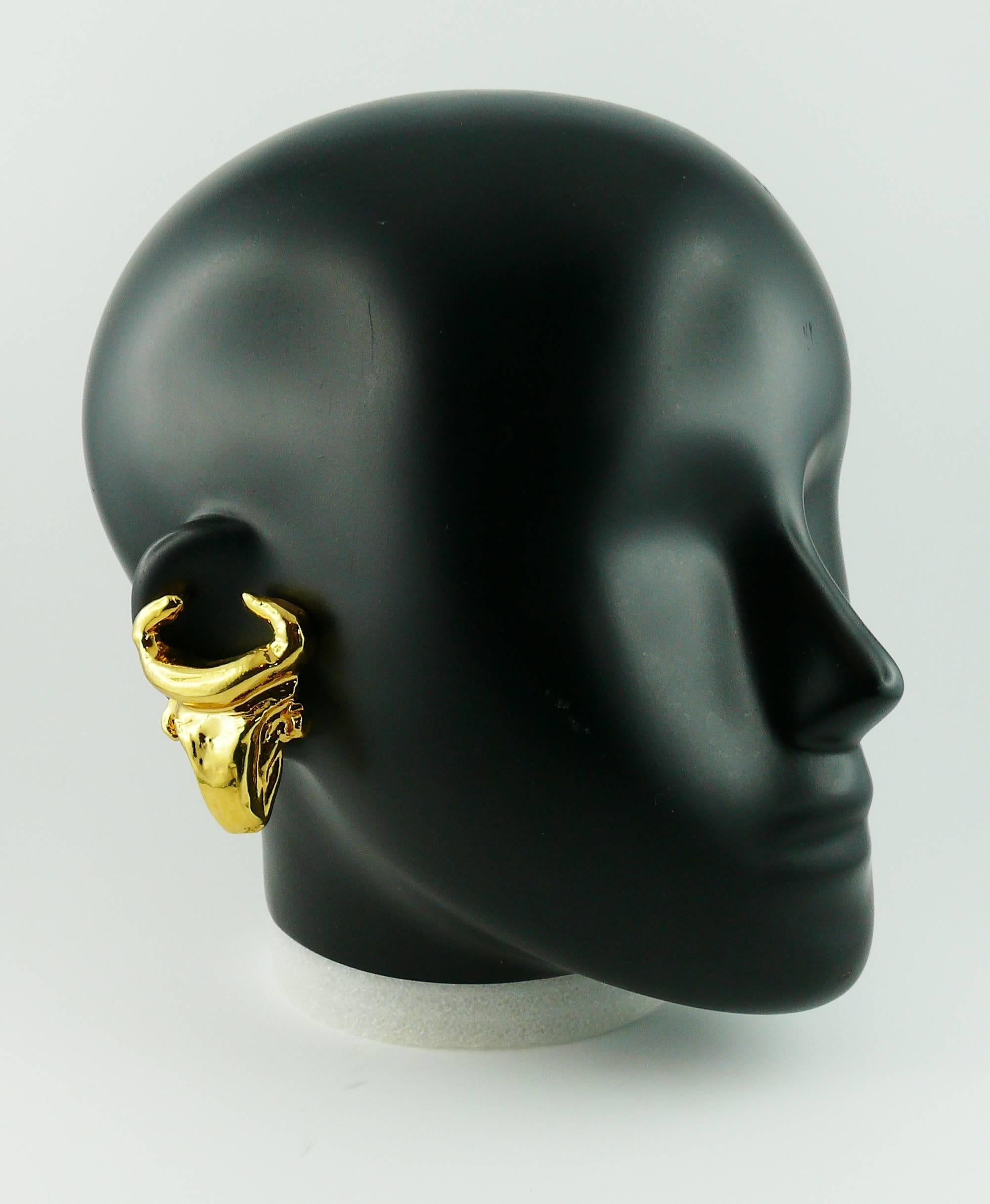CHRISTIAN LACROIX vintage gold tone clip-on earrings featuring a stylized bull head.

Arlesian bullfighting iconic CHRISTIAN LACROIX design.

Marked CHRISTIAN LACROIX CL Made in France.

JEWELRY CONDITION CHART
- New or never worn : item is in