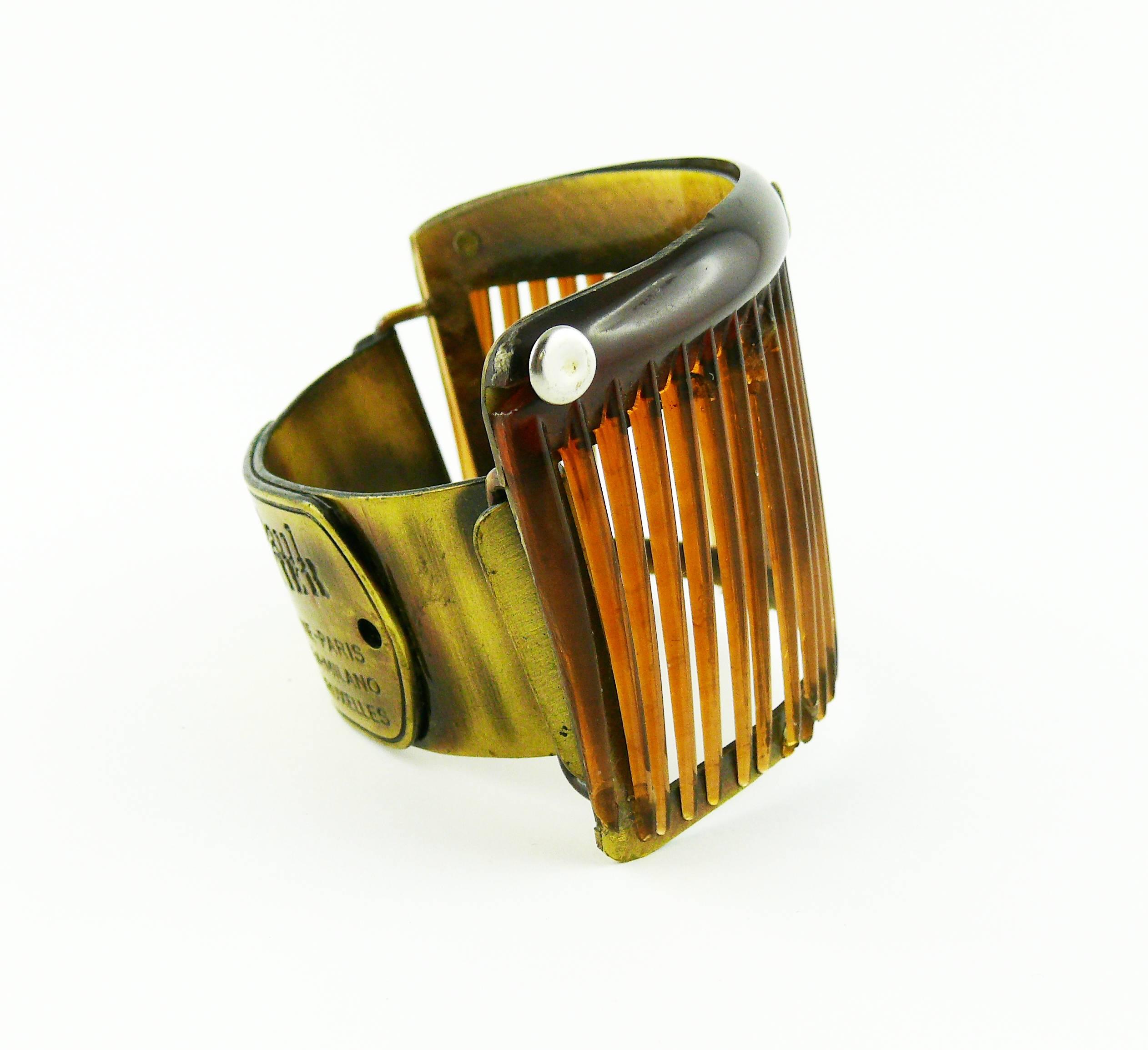 JEAN PAUL GAULTIER vintage rare cuff bracelet featuring a comb "cage" design.

Embossed JEAN PAUL GAULTIER.

Indicative measurements : inside circumference approx. 17.28 cm (6.80 inches) / width approx. 5.7 cm (2.24 inches).

JEWELRY