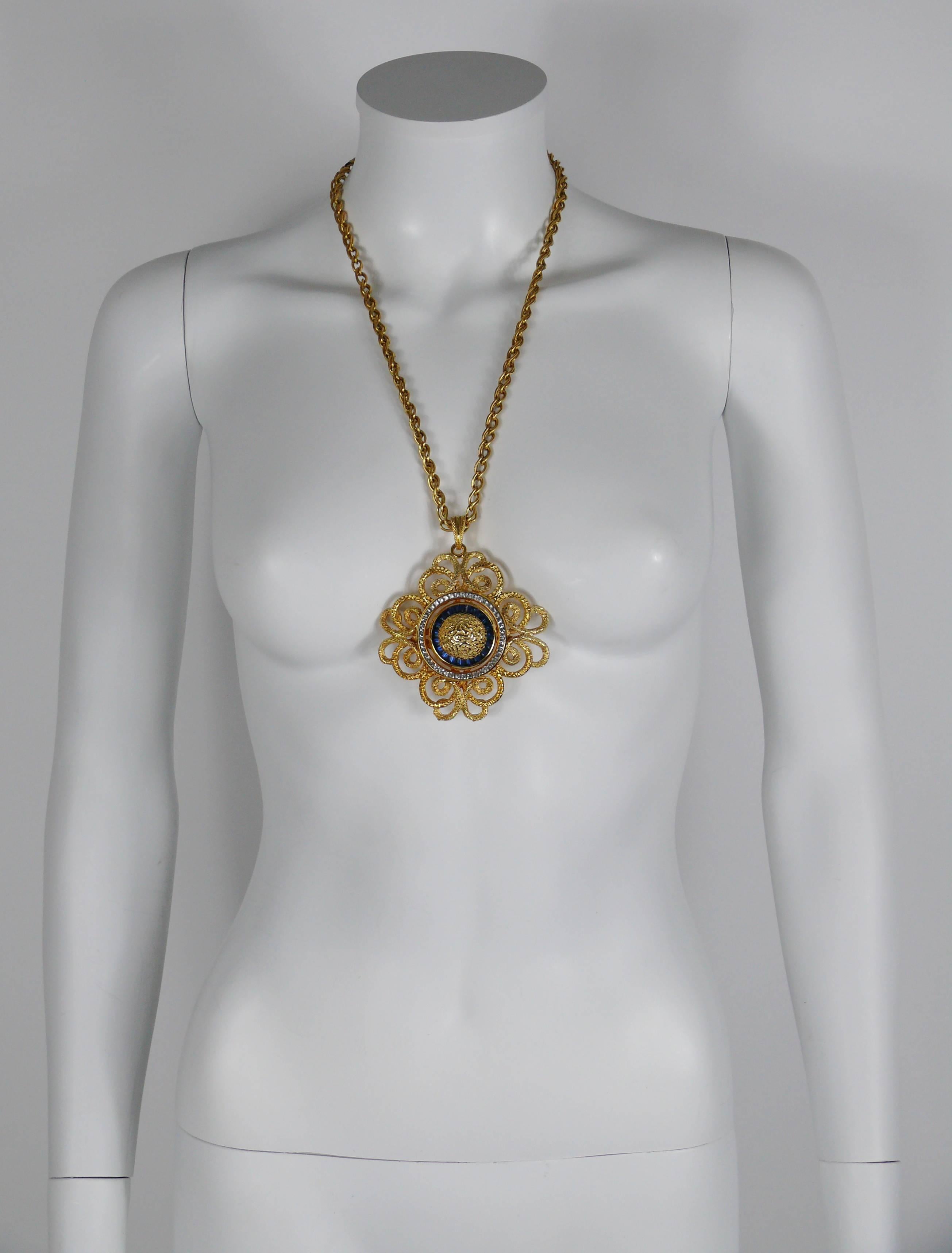 LUCIEN PICCARD vintage gold toned necklace featuring a massive openwork pendant embellished with diamante and faux sapphires.

Embossed LUCIEN PICCARD.
Numbered 113H.

Indicative measurements : length worn approx. 35 cm (13.78 inches) / pendant