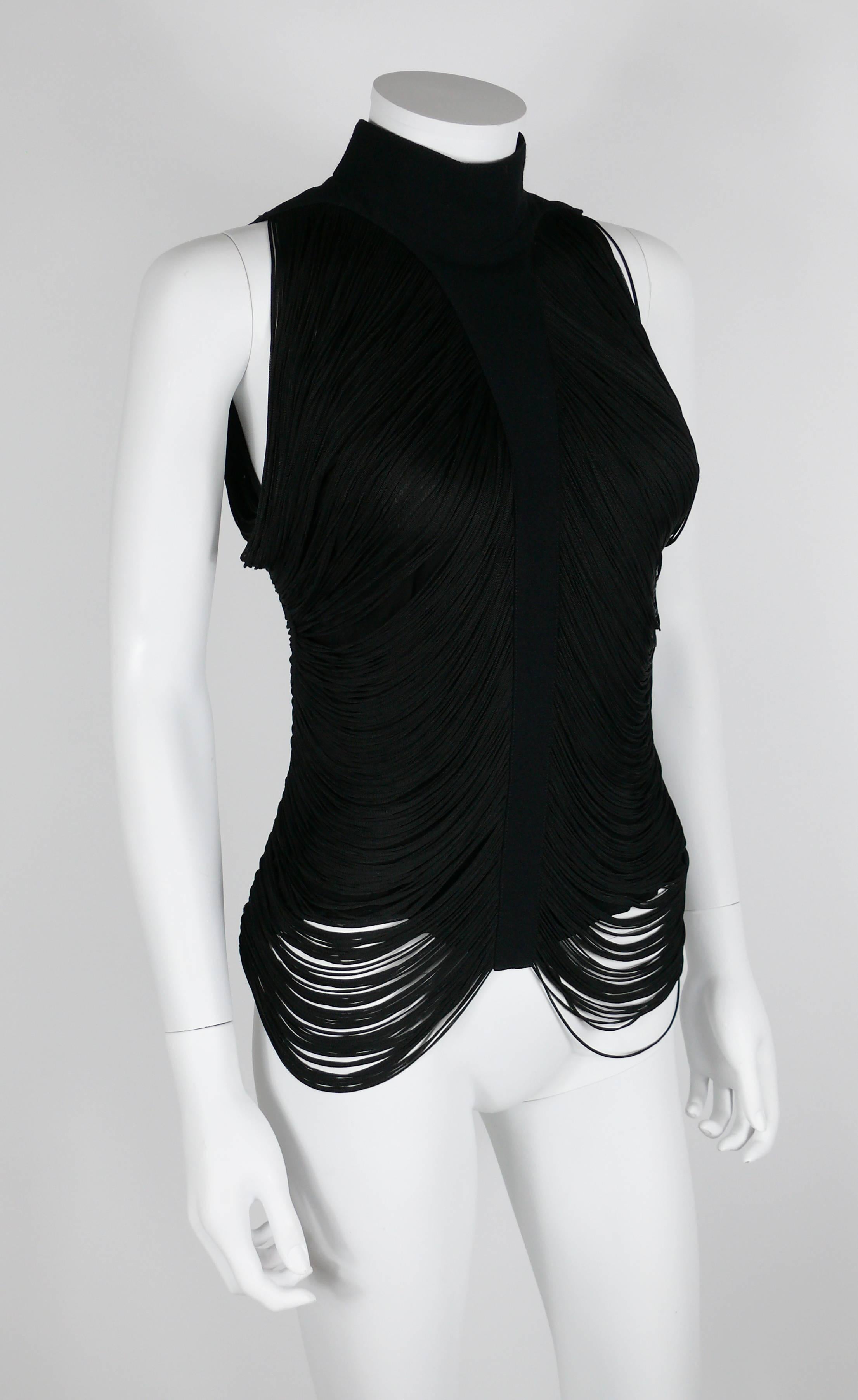 THIERRY MUGLER vintage black fringed top.

This gorgeous top consists of a black viscose voile base covered with a fringe drapery design.

Turtle neck.
Back button fastening.

Label reads THIERRY MUGLER Paris Made in France. 

Composition : 100 %