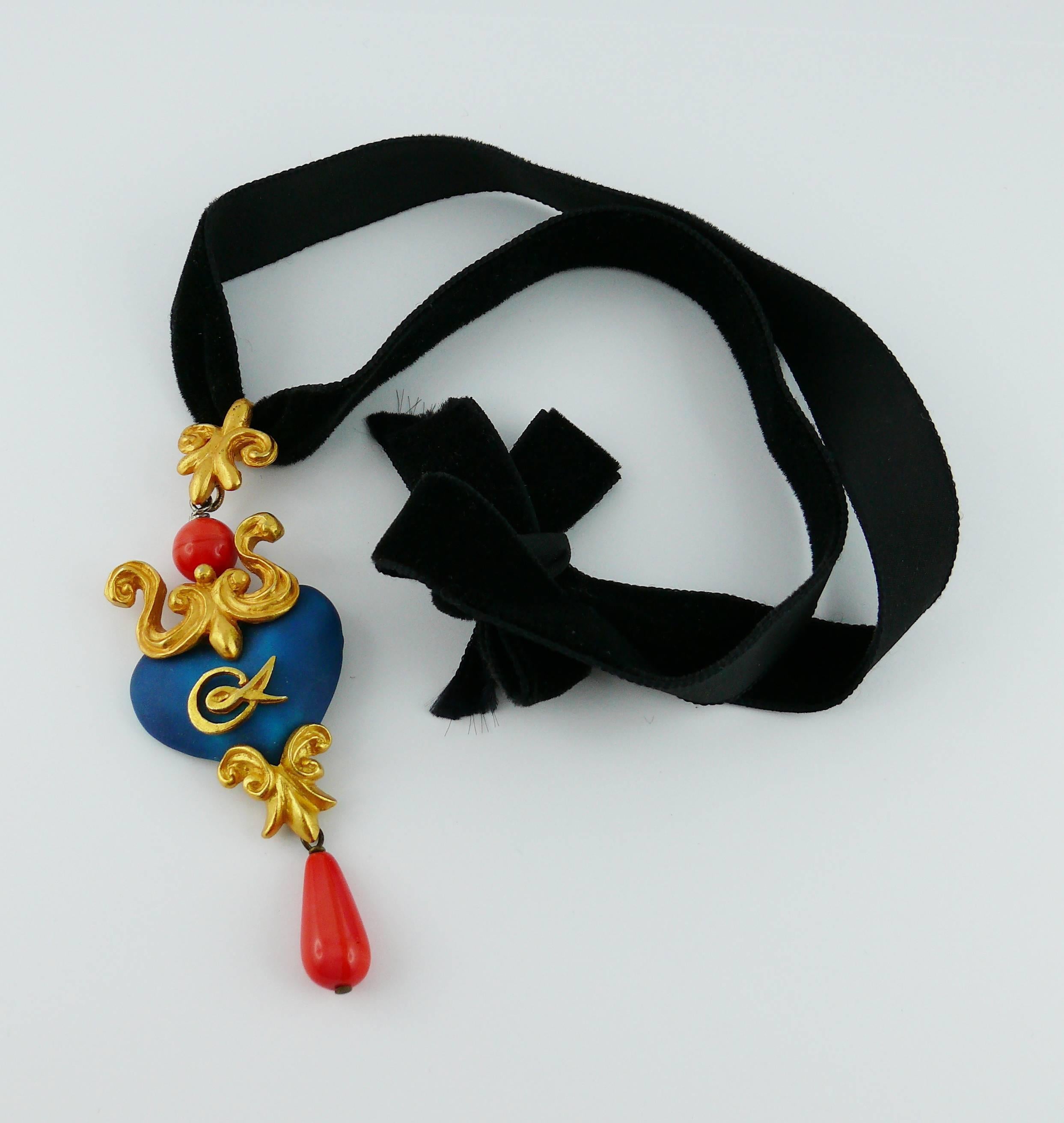 CHRISTIAN LACROIX vintage pendant necklace featuring a gorgeous Baroque enameled heart adorned with gold tone elements and faux coral beads.

Black velvet ribbon rope.

CL monogram on heart front.

Indicative measurements : length worn approx.