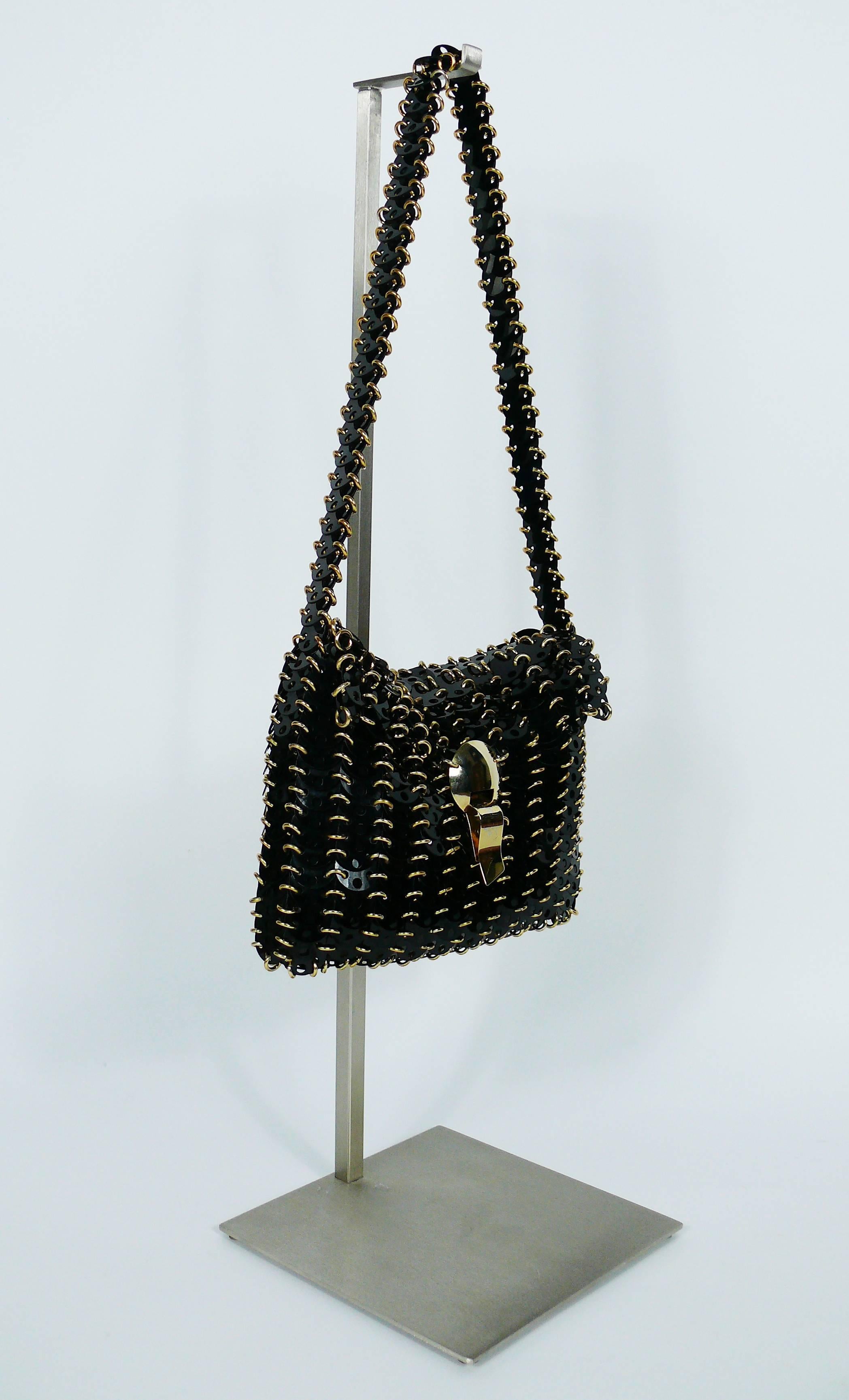 PACO RABANNE vintage shoulder bag from the 1970s featuring black rodhoid discs and gold toned harware.

Marked PACO RABANNE Paris - Production R I C A F Italy.

Indicative measurements : height incl. strap approx. 42 cm (16.54 inches) / height excl.