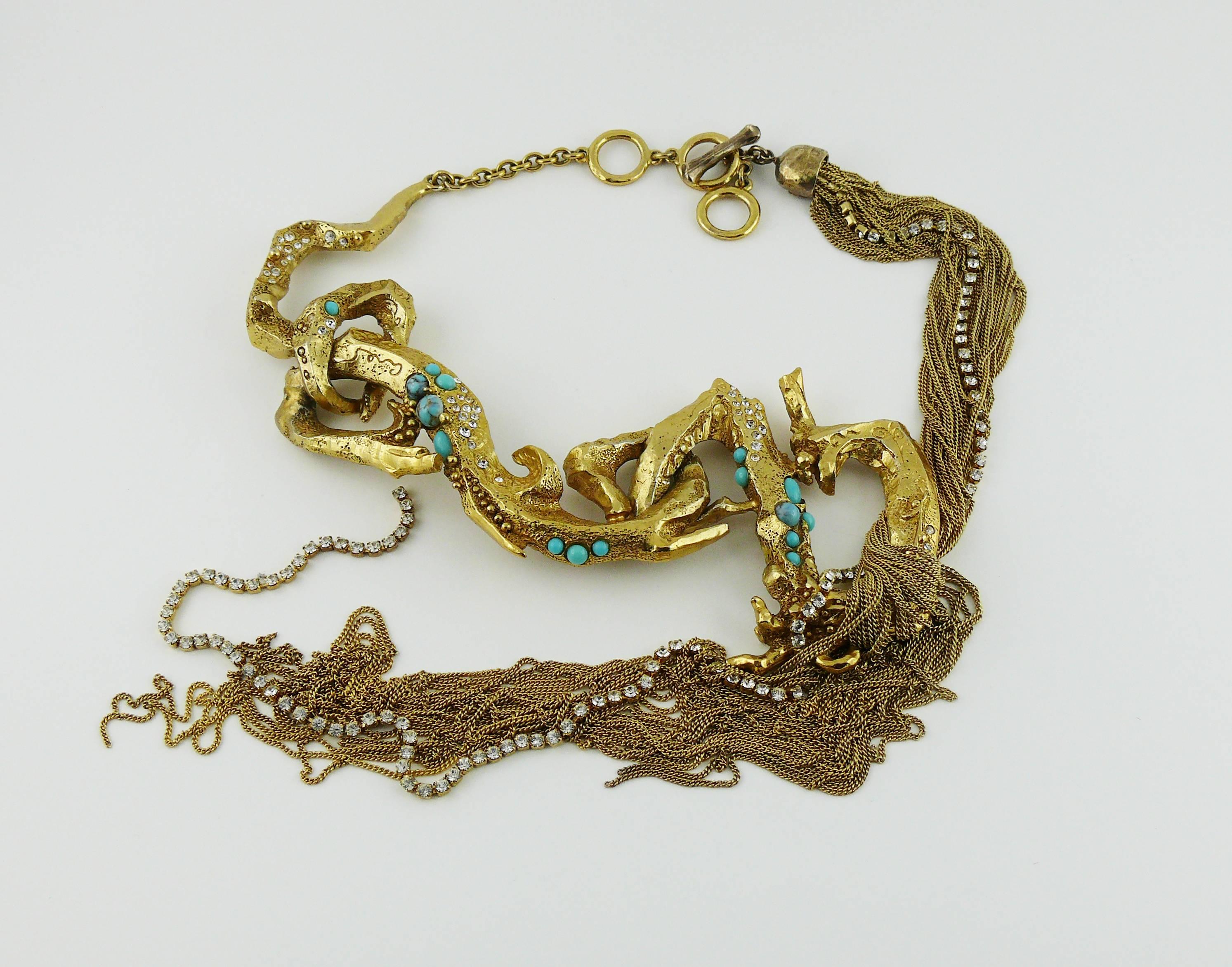 CHRISTIAN LACROIX vintage opulent runway necklace featuring gold toned textured intertwined branches embellished with faux turquoise cabochons and clear crystals. Extra long chain pendant.

T-bar closure.
Extension chain.

Marked CHRISTIAN