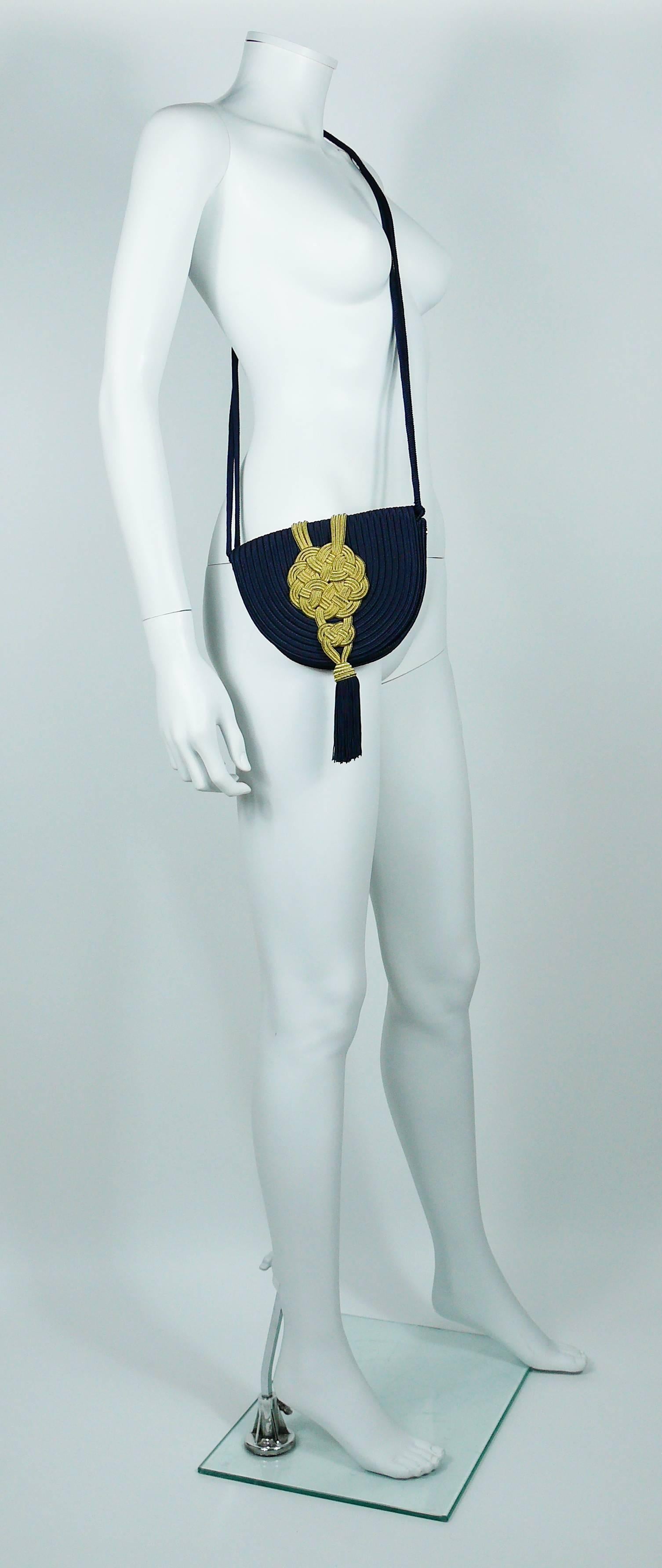 YVES SAINT LAURENT Rive Gauche vintage oriental inspired navy blue passementerie and tassel evening purse.

This purse features :
- Navy blue body adorned with massive gold lame passementerie ornaments on front and back.
- Navy blue tassel.
-
