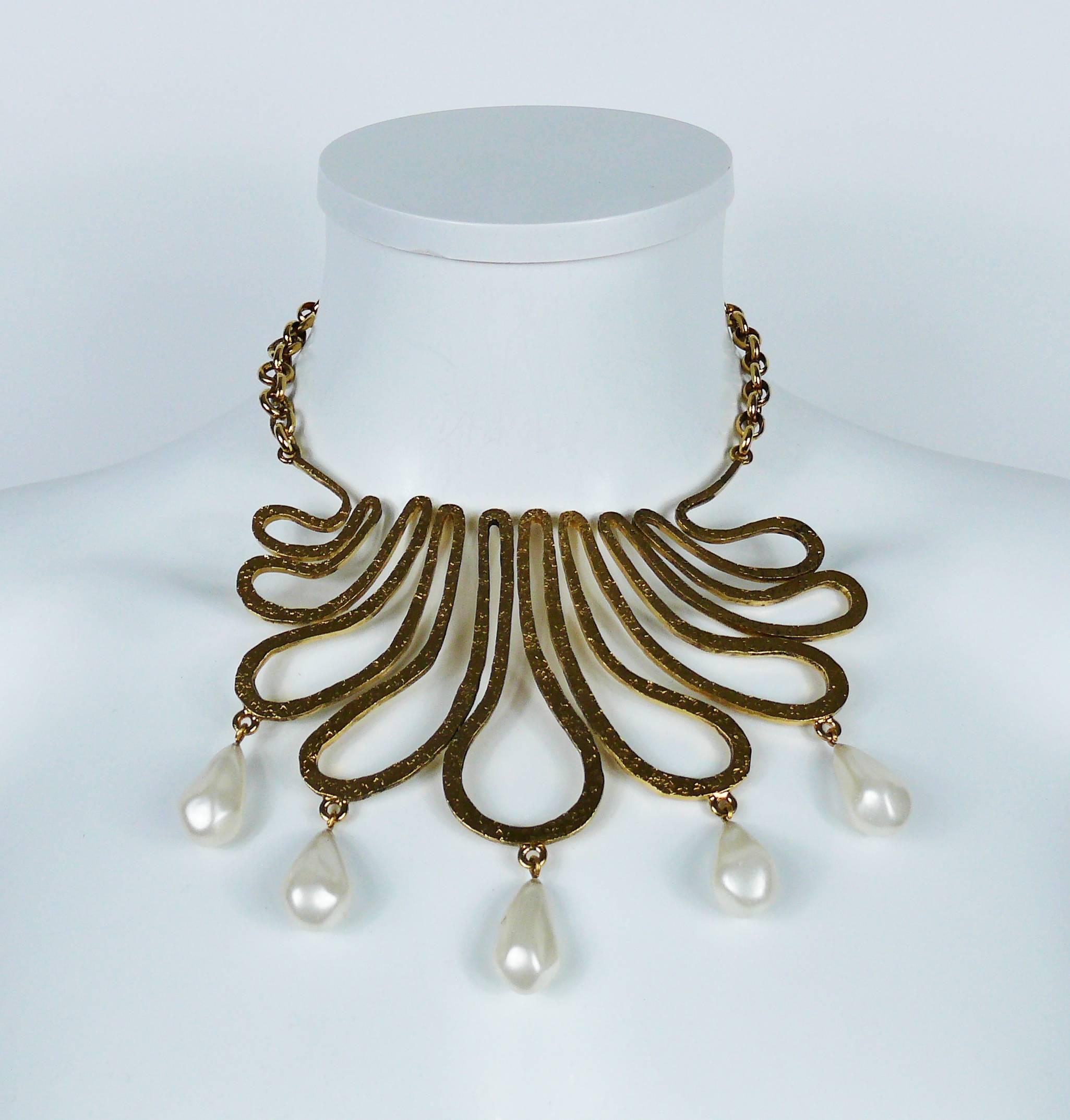 CHANEL vintage gold toned bib necklace featuring a gorgeous arabesque design embellished with five large glass faux pearl drops.

Circa 1990.

Embossed CHANEL.

Indicative measurements : inner circumference approx. 34.56 cm (13.61 inches) -