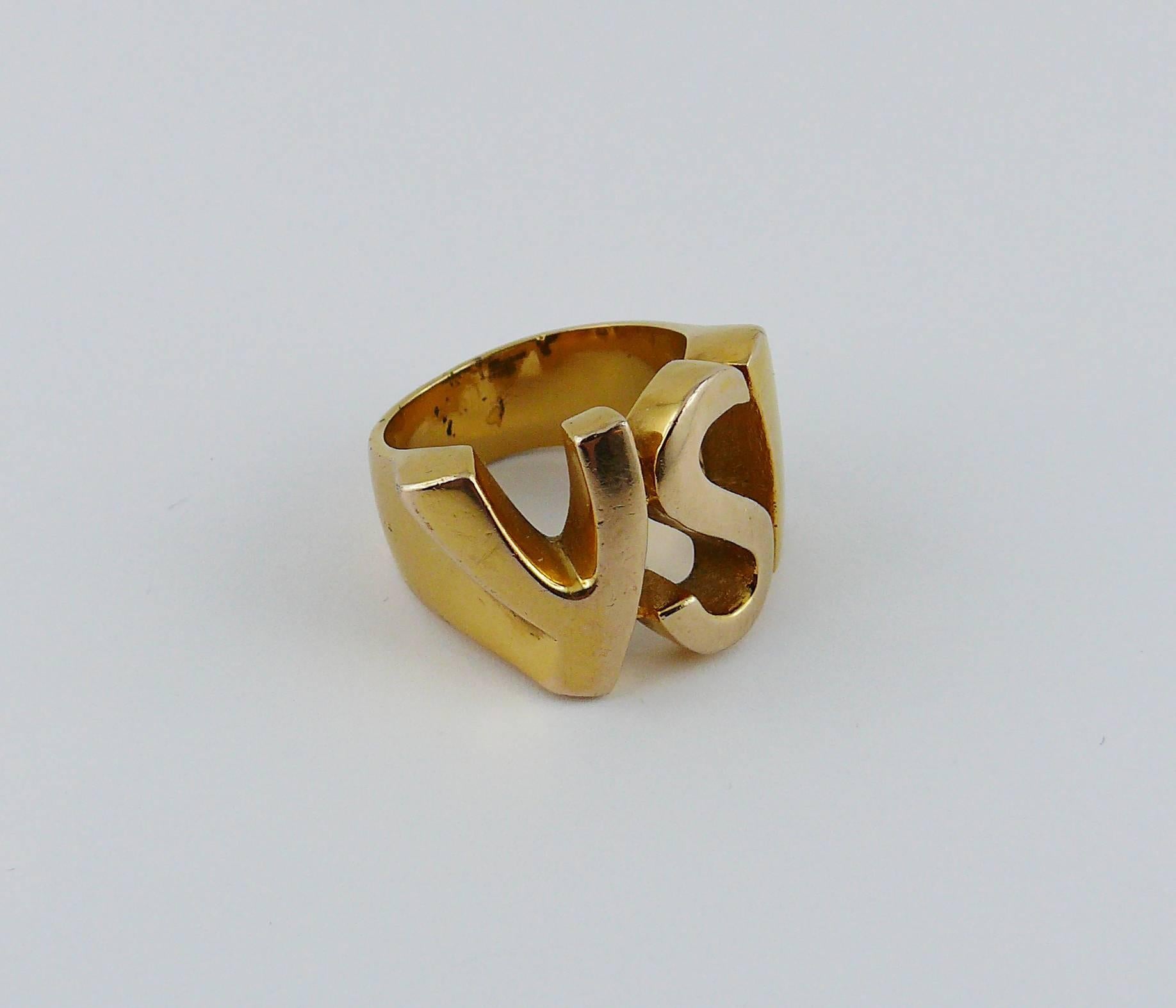 YVES SAINT LAURENT vintage gold toned signed ring featuring YSL monogram.

Embossed YSL.

Indicative measurements : inner circumference approx. 5.65 cm (2.22 inches) / logo width approx. 1.6 cm (0.63 inch).

JEWELRY CONDITION CHART
- New or never