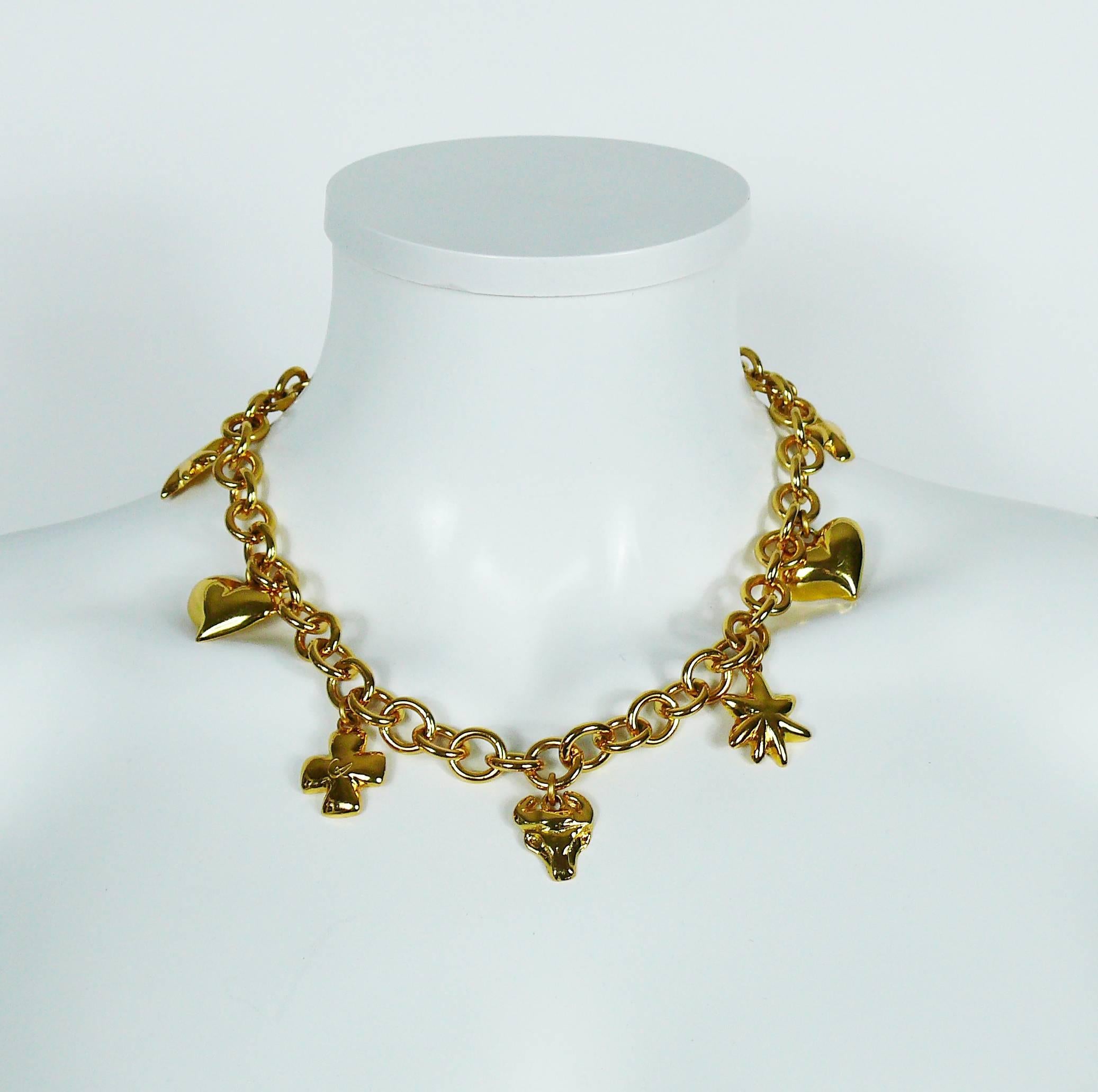 CHRISTIAN LACROIX vintage gold toned necklace featuring a chunky chain embellished with iconic charms : heart, sun, cross and bull head.

T bar and toggle closure.

Marked CHRISTIAN LACROIX CL Made in France.

Indicative measurements : max. length
