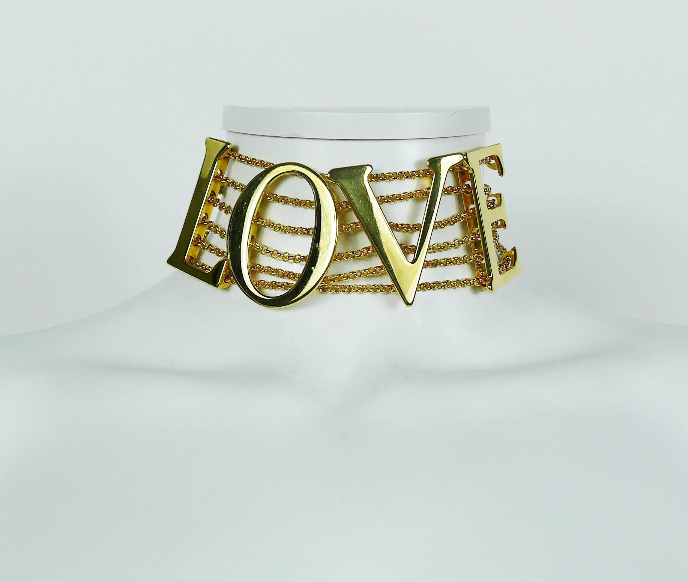 DOLCE & GABBANA iconic gold toned runway choker necklace featuring large LOVE characters attached on six chains.

Spring/Summer Ready-to-Wear 2003 "LOVE SEX" Collection.
Similar model worn by NATALIA VODIANOVA on the catwalk.

The LOVE