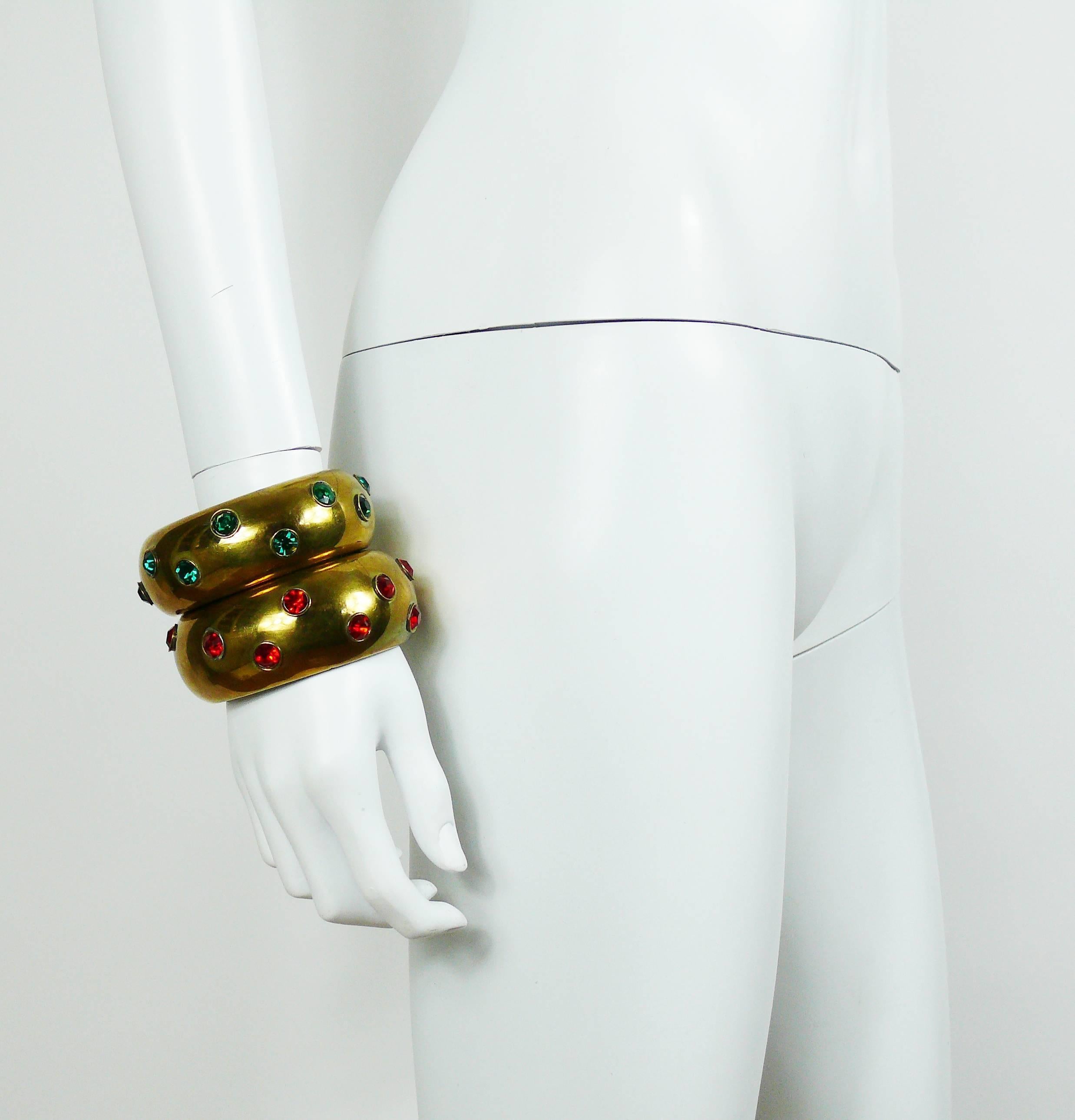 YVES SAINT LAURENT (attributed to) two vintage brass cuff bracelets embellished with faux emerald and faux ruby crystals.

Circa 1985.

Unsigned runway pieces.
Identical pieces -  "BIJOUX HAUTE-COUTURE, 28th of April 2014, DROUOT Paris"