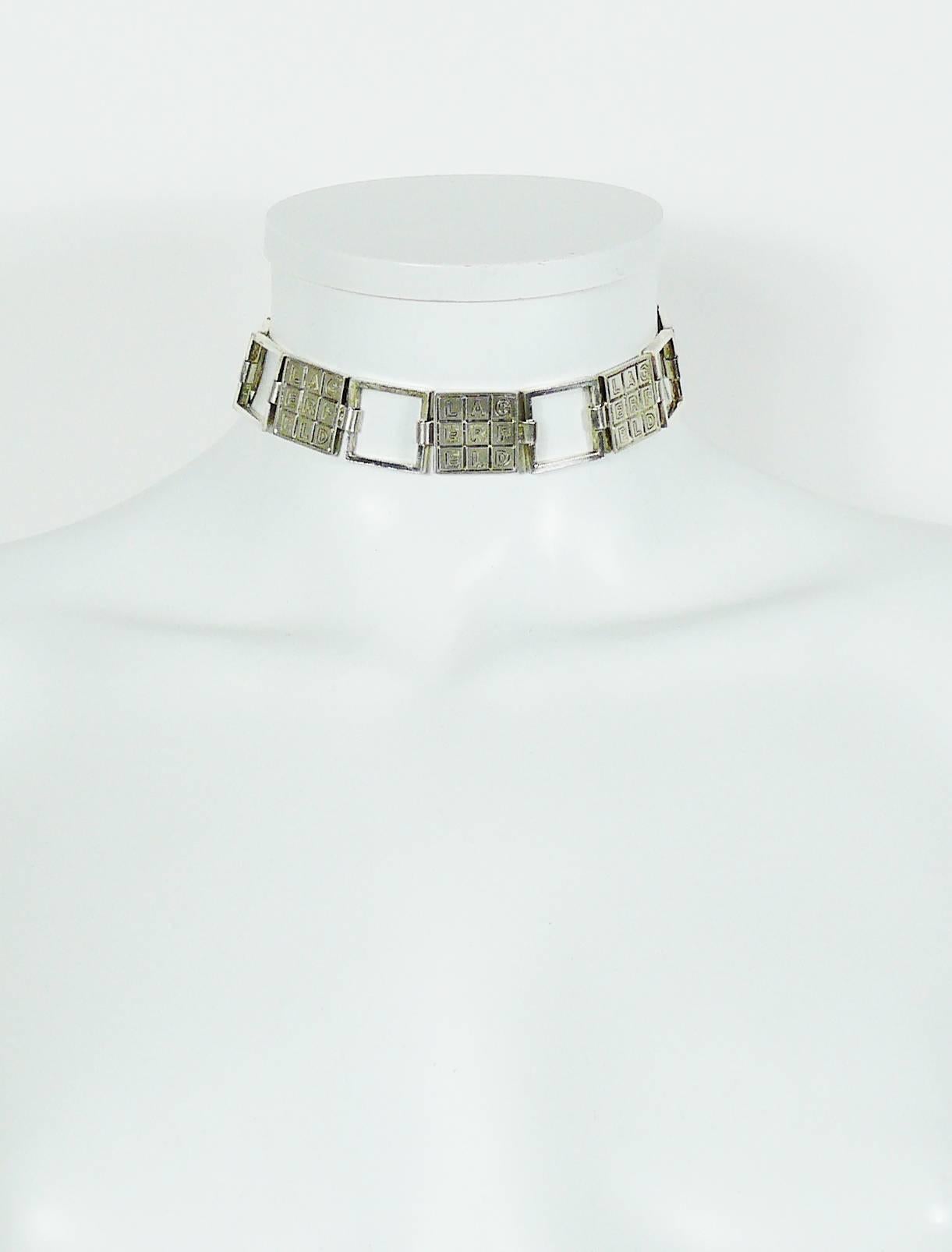 KARL LAGERFELD vintage silver toned crossword puzzle link necklace.

Lobster clasp closure.
Extension chain.

Indicative measurements : adjustable length from approx. 32 cm (12.60 inches) to approx. 36 cm (14.17 inches) / link width approx. 2 cm
