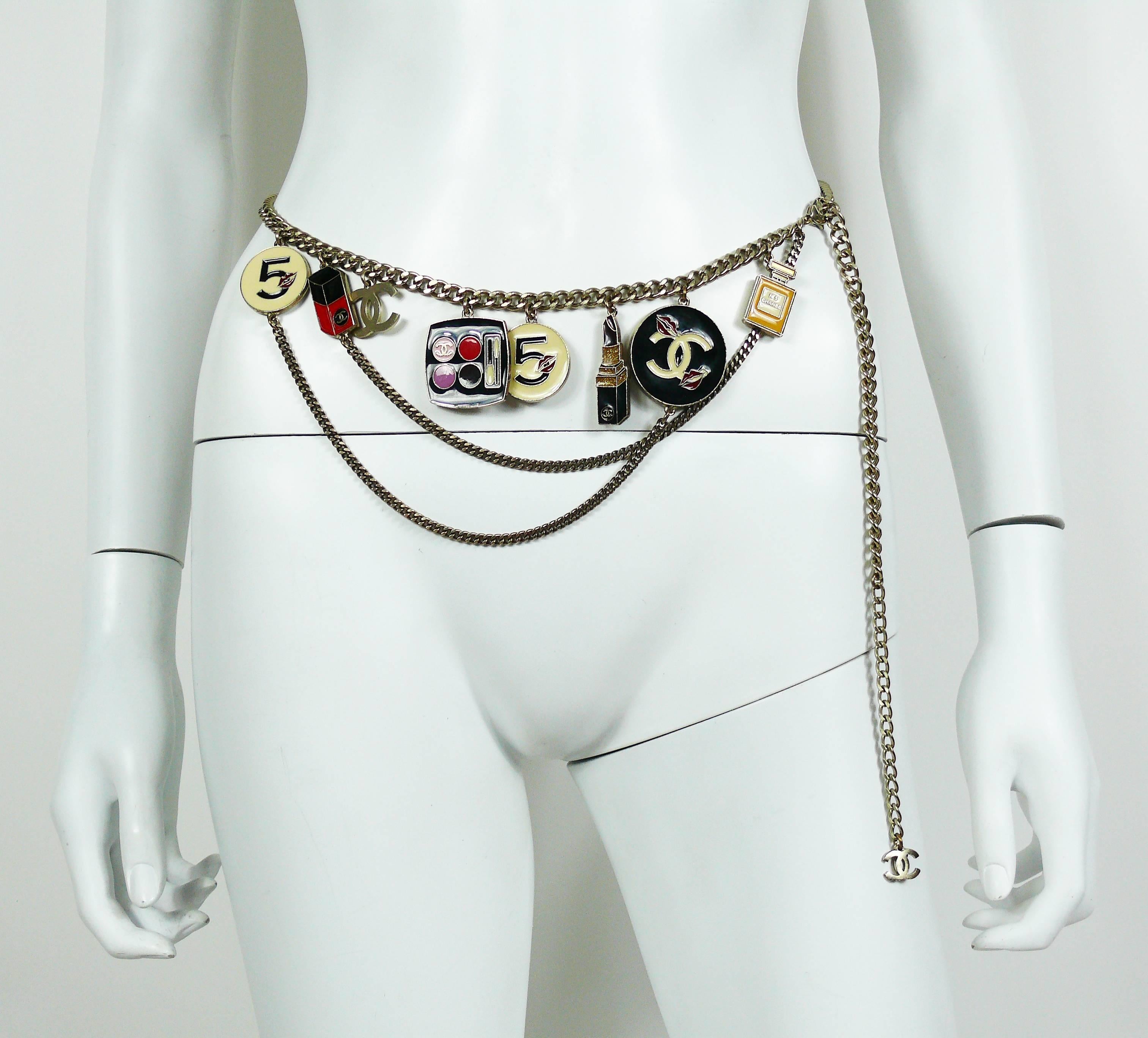 CHANEL rare make-up charm runway belt.

Fall/Winter 2004 Ready-to-Wear collection.
Look 43.

May we worn as a necklace.

This belt features :
- Multi strand silver toned chains.
- Seven large enamel make-up charms (Chanel N°5 perfume bottle,