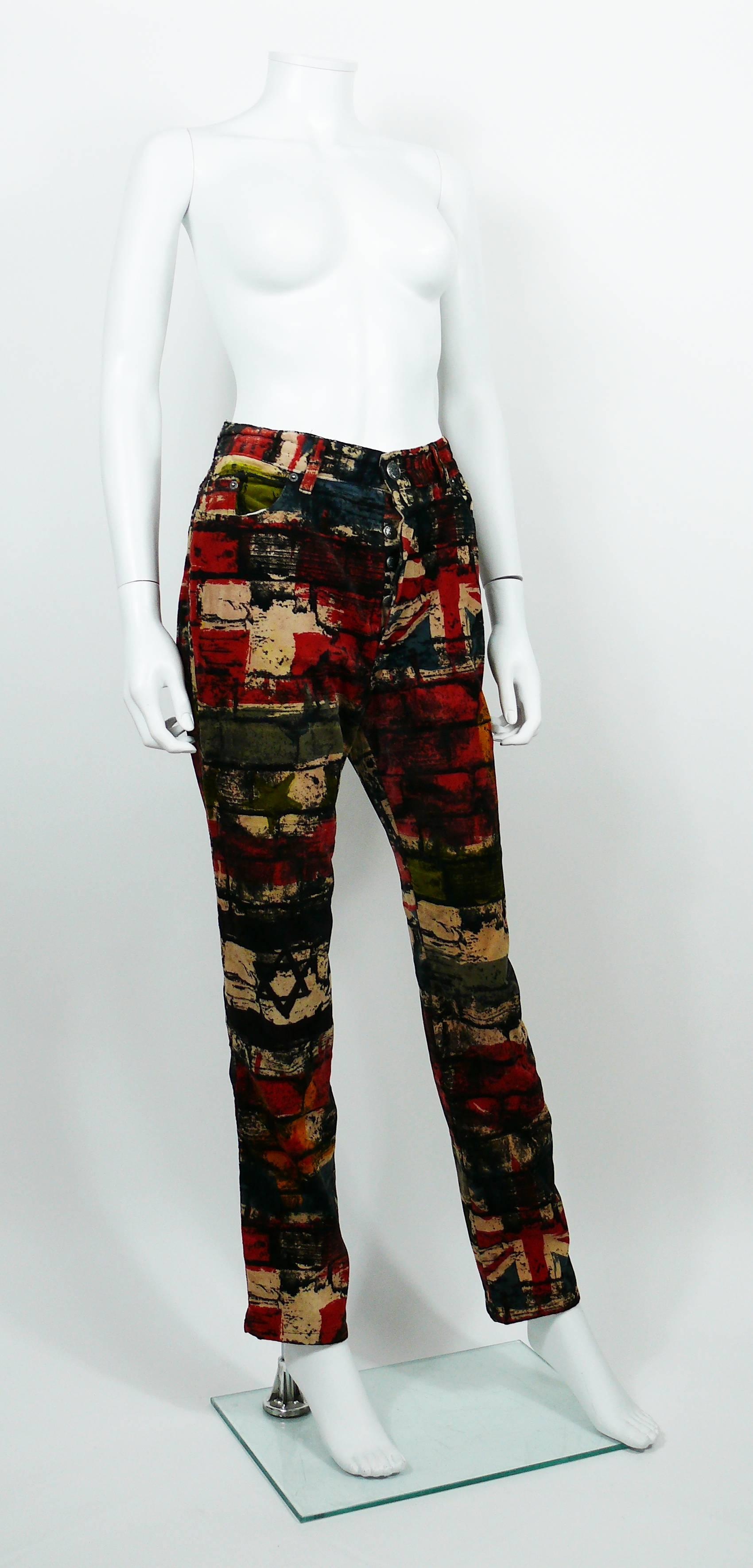 JEAN PAUL GAULTIER vintage pants trousers featuring a multi colored wall and flags print.

These trousers feature :
- Velvety touch material.
- Front buttoning.
- Front and back pockets.
- Belt loops and signature brand loop at the back.

Label