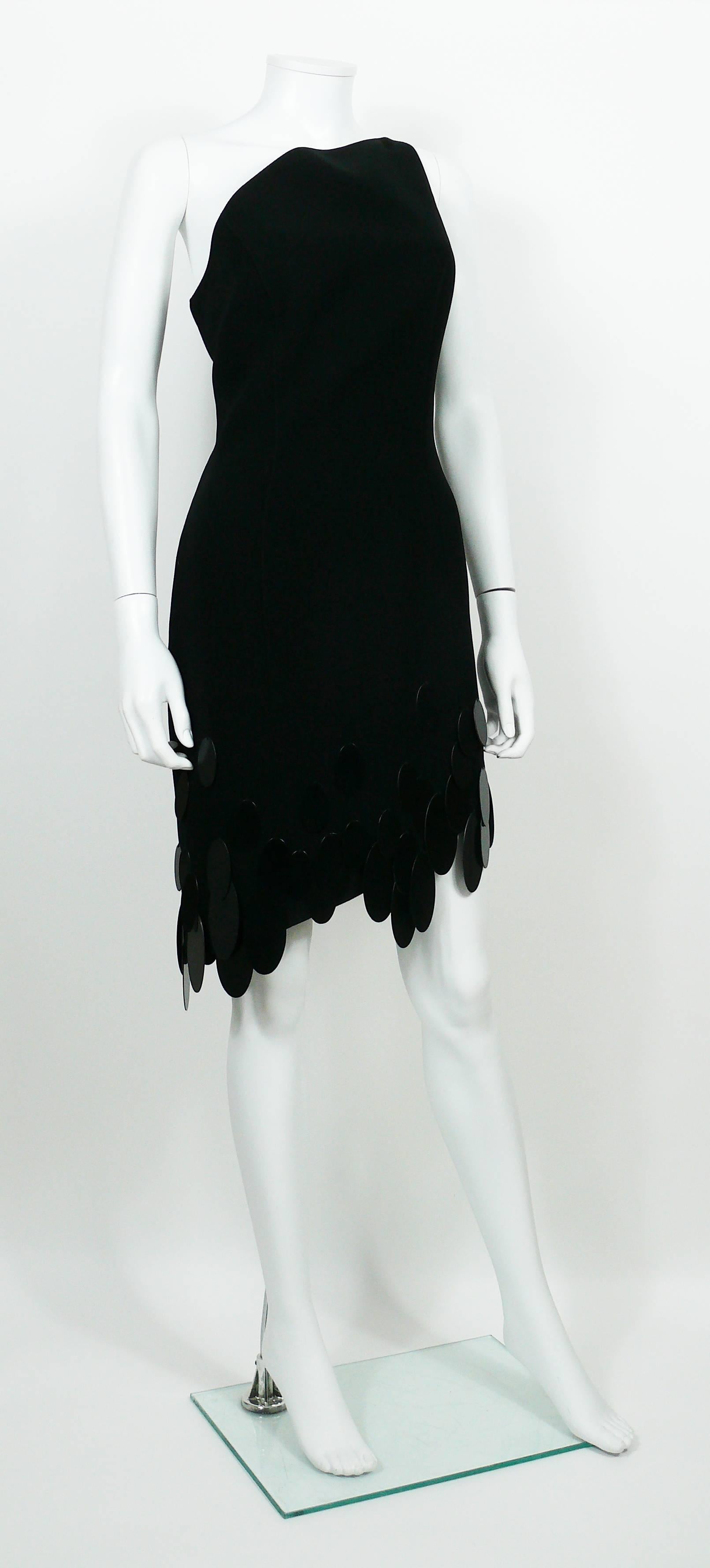 THIERRY MUGLER vintage one shoulder asymmetric black dress with rhodoid discs embellishement. 

Label reads THIERRY MUGLER Paris Made in France.

Size label reads : 42.
Please refer to measurements.

Missing composition tag.

Indicative measurements