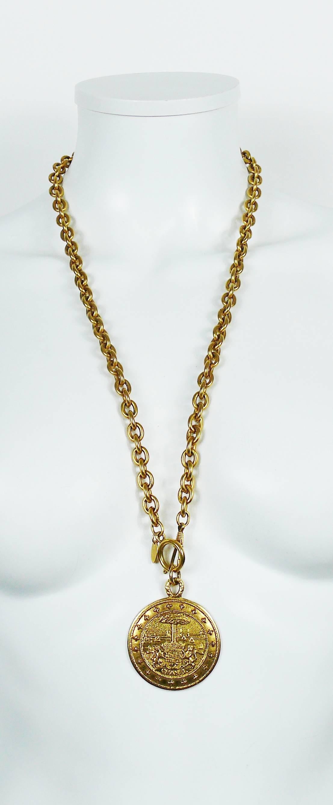 CHANEL vintage gold toned necklace featuring a coat of arm medallion pendant and a bold link chain.

Spring clasp closure.

Embossed CHANEL Made in France.
Private sale "S" engraved on the reverse of the pendant (invisible when
