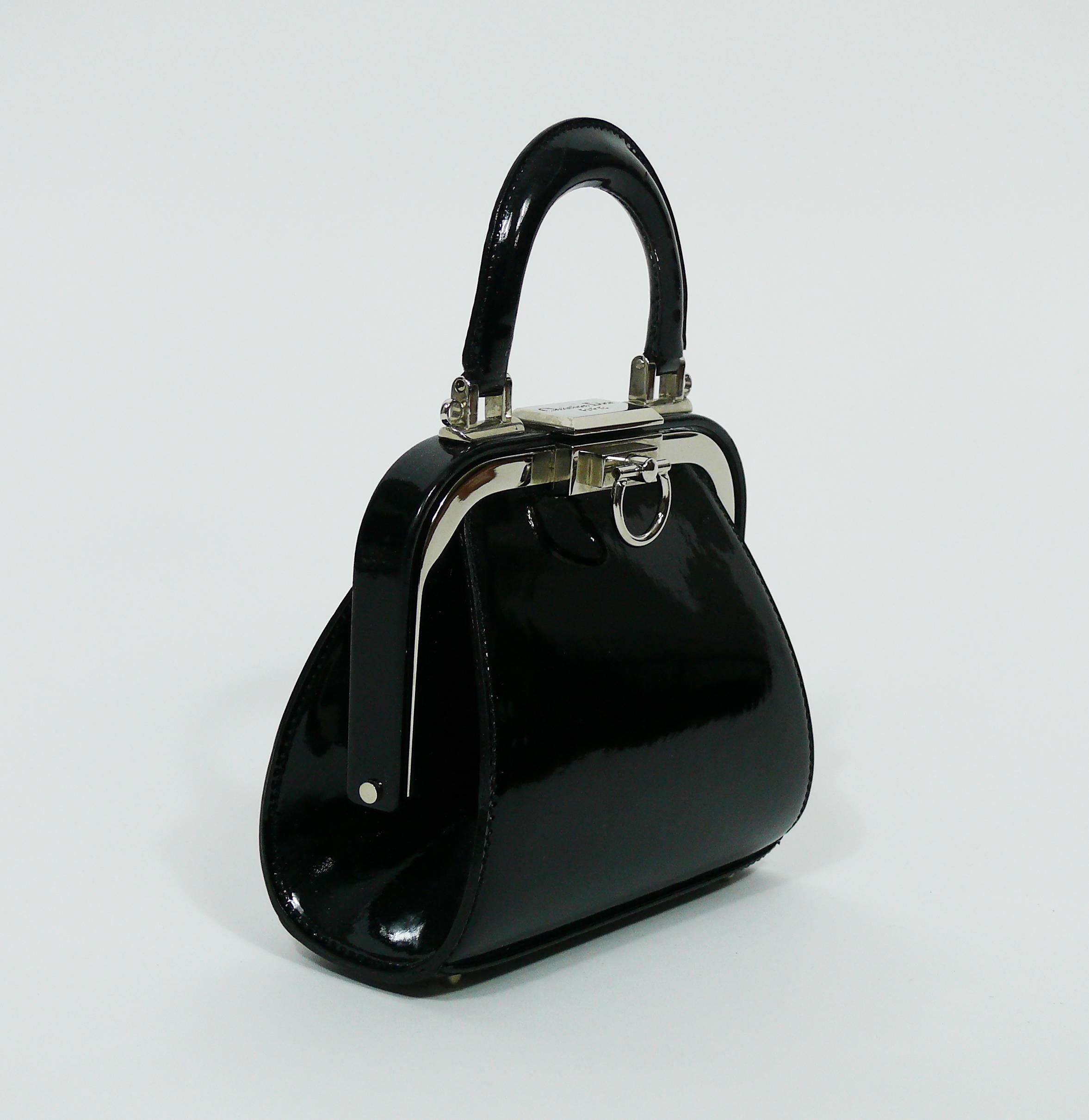 CHRISTIAN DIOR vintage rare doctor style micro mini handbag in black patent leather.

Silver toned hardware.
Black cannage motif lining.

One inner pocket.

Engraved CHRISTIAN DIOR Paris on the clasp.
Embossed on a leather label CHRISTIAN DIOR
