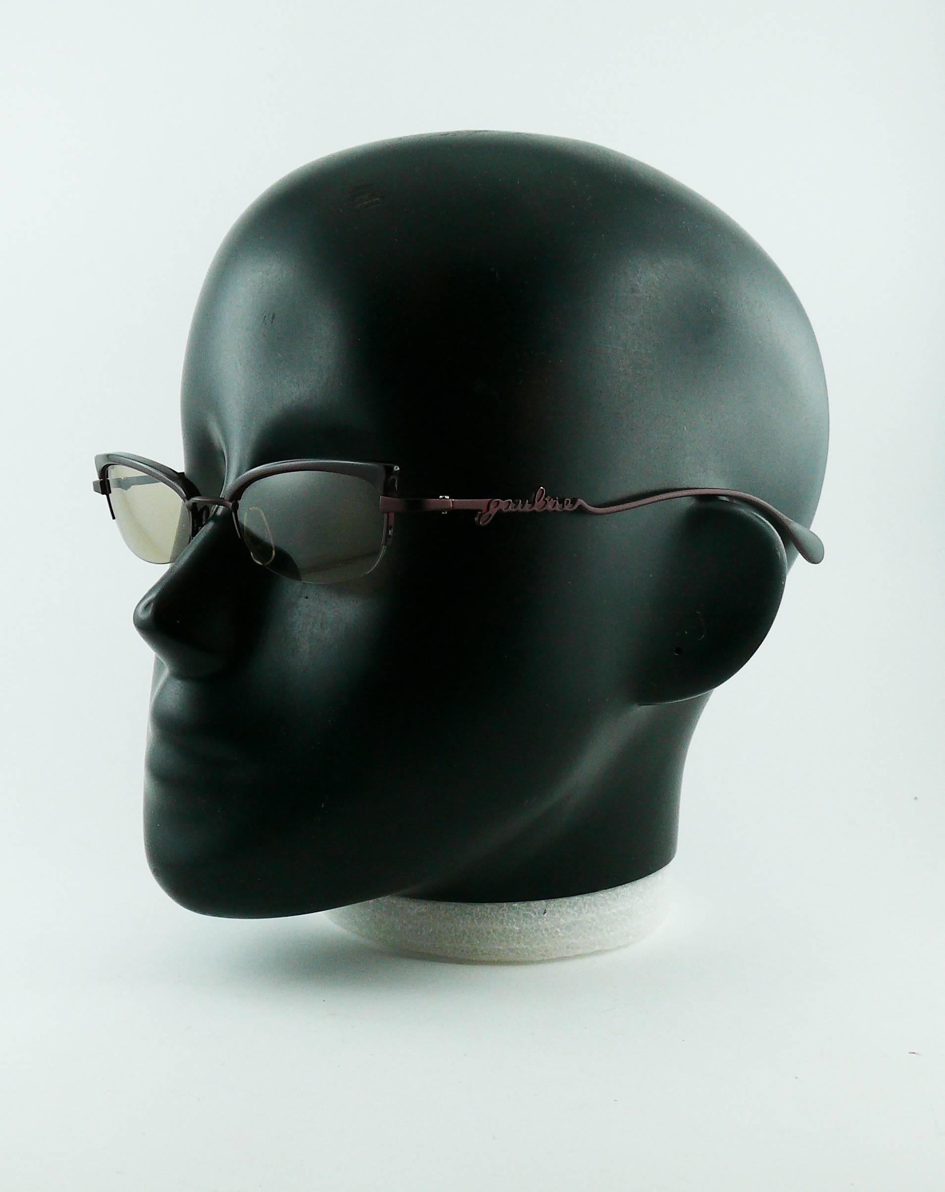 JEAN PAUL GAULTIER rare cat eye sunglasses.

Deep ruby red frames.
Tinted lenses.

Marked JEAN PAUL GAULTIER.
56-0069.

Indicative measurements : width approx. 13.9 cm (5.47 inches) / width between lenses approx. 1.6 cm (0.63 inch) / lenses width