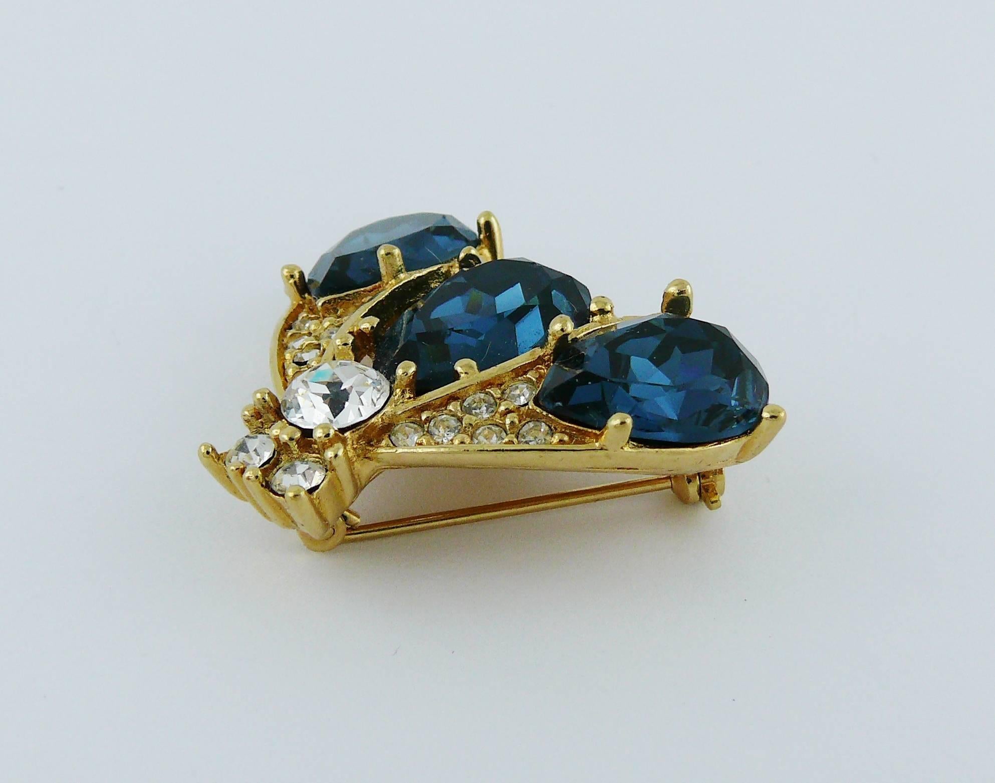 CHRISTIAN DIOR gold toned iconic bee brooch embellished with faux sapphire and clear crystals.

Marked CHRISTIAN DIOR Boutique.

Indicative measurements : approx 2.5 cm x 3.3 cm (0.98 inch x 1.30 inches).

JEWELRY CONDITION CHART
- New or never worn